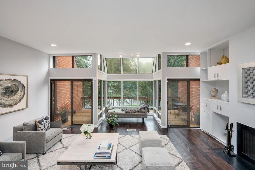 Fall in love with elevated simplicity in sought-after Stevenson Crossing. If you’ve been yearning for a completely updated, spacious and light-filled patio home then this is the one for you. Absolutely stunning with walls of glass and sophisticated finishes. Move right in and enjoy. A rare offering, this is one of the largest homes in the neighborhood with additional finished space connecting the oversized eat-in kitchen directly with garage. There’s no need to walk outside in bad weather! Step into your great room and feel completely connected to the outdoors with floor to ceiling glass overlooking a backdrop of greens.Thoughtful details include engineered hardwood floors throughout first and second floors, elaborate built-ins, custom window treatments and interesting design features to name a few. The second floor offers a flexible layout with two spacious en-suite bedrooms. Flooded with natural light, the primary suite is complete with gorgeous custom bathroom, an enviable closet and large finished bonus room above garage. Third bedroom and bathroom are in bright and airy lower level. Step downstairs to find high ceilings, a great recreation space and  another fabulous wall of glass that leads out to sunny grass. Offering a gated entrance for residents and incredible amenities such as pool/pool house, tennis and basketball courts, Stevenson Crossing is a unique community where you can embrace easy living  and total convenience without giving on inspiring architecture. The art of uniting human and home.