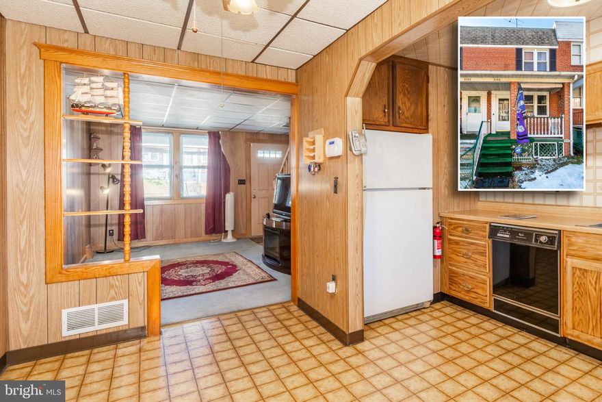 ESTATE SALE!  TURN KEY ROWHOME WITH 3 FINISHED LEVELS AND A REAR PATIO!  Main level features a  charming living room, large eat-in kitchen w/ a dining area, upper level with 2 bedrooms and 1 full bath, walkout finished basement with a family room and laundry room, main level rear balcony, and a rear patio with a storage shed.  Sold As-Is!  Seller will make no repairs