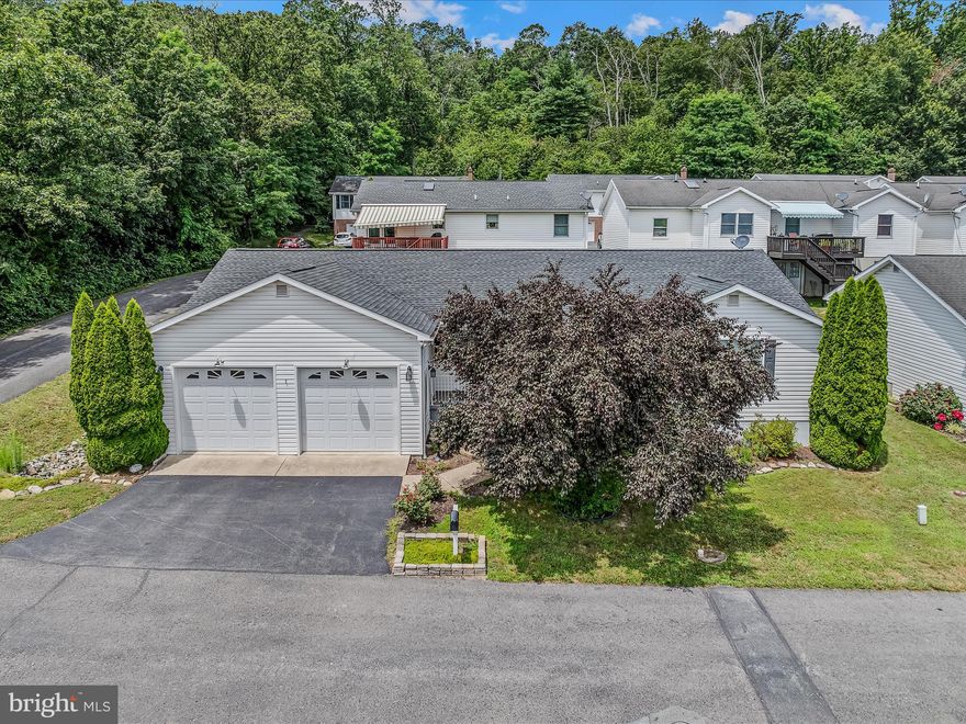 Easy living! Located in the charming Morgan Terrace community for ALL AGES, this sweet raised ranch offers a perfect blend of comfort and convenience. With 1,524 sq. ft. of well-designed living space, this home features two spacious bedrooms and two full bathrooms, ideal for relaxation and everyday living. The heart of the home boasts a kitchen equipped with essential appliances, including a built-in microwave, refrigerator, dishwasher, and electric oven, making meal prep a breeze. Step outside to enjoy your private deck or the front porch, perfect for morning coffee. Home needs a little painting and freshening but appears to be in great shape otherwise. Roof was replaced around 2018 but a couple of interior ceiling spots were not addressed. The attached two-car garage and paved driveway provide ample parking including an interior and exterior access. Morgan Terrace is known for its convenience-just minutes from downtown Berkeley Springs with shopping and recreational areas nearby. Residents benefit from community services like snow removal and lawn maintenance, ensuring a hassle-free lifestyle.