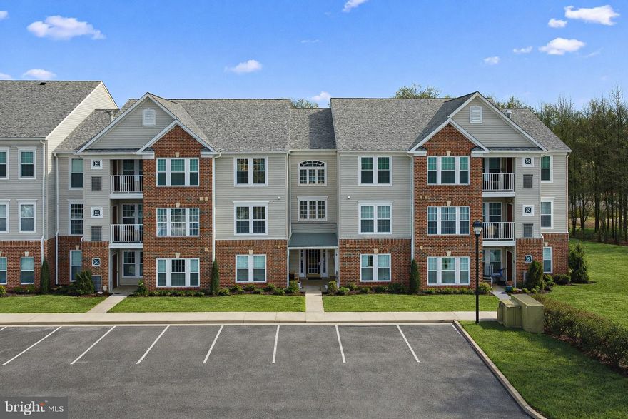 Beautifully maintained 2BR/2BA garden-style condo offering 1,214 sq ft of comfortable, single-level living with new carpet and fresh paint throughout. This inviting home features a bright, open layout with generous natural light and a seamless flow from the living and dining areas—ideal for everyday living and entertaining.

The kitchen provides ample cabinet and counter space and includes newer appliances, making meal prep a breeze. Both bedrooms are generously sized, and the home offers two full bathrooms, including an updated vanity and modern finishes. The home also features a conveniently located laundry closet, thoughtfully tucked away for added functionality and ease of everyday living.

Enjoy the convenience of an elevator building and community amenities including common grounds, plus a condo fee that covers water, sewer, trash, snow removal, exterior maintenance, management, insurance, and reserve funds. Central A/C and natural gas forced-air heat provide year-round comfort. Parking lot access included. Pets are permitted subject to association restrictions.

Don’t miss your opportunity to own a move-in-ready condo in Perry Hall Farms Garden Condos!