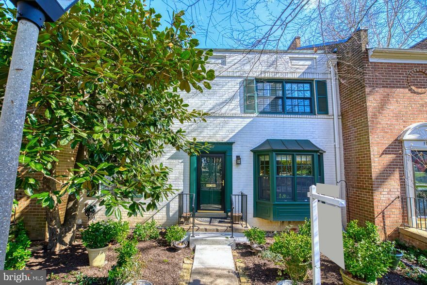 First Open House Sunday 3/13 from 1 to 3!! Reston is consistently voted by Washingtonian and Money Magazine one of the Best Places to Live and Best Places to Work in the country.  Home to 4 lakes, 16 community swimming pools, 60 sets of tennis courts and over 60 miles of paved pathways connecting the villages/lakes and amenities.  Every now and then a special house comes up for sale in a special, unique community and this is that house.  It gets no better than this ... Governors Square is one of Reston's most sought-after and charming communities a stone's throw from spectacular Reston Town Center.   Just 28 townhomes built around a central community courtyard.  All brick construction and stunning enclosed rear gardens.   In one direction, a five-minute walk to Reston Town Center, in the opposite direction five minutes to Lake Anne Plaza for shops/restaurants/concerts and one of the best farmers markets in the DMV.  Governors Square is known for the stunning, sweeping, curved staircases off the foyer - these are the only homes the builder did in Reston. One of the largest models in the cluster, this house offers four bedrooms including a hard-to-find main level bedroom or den.  Walk-out lower level to enclosed Georgetown style garden with a 50+ year old specimen Japanese Maple tree. Updated top to bottom with new kitchen, bathrooms, floors, doors and windows (Andersen).   Updated roof/furnace/hot water heater and new Ipe deck.