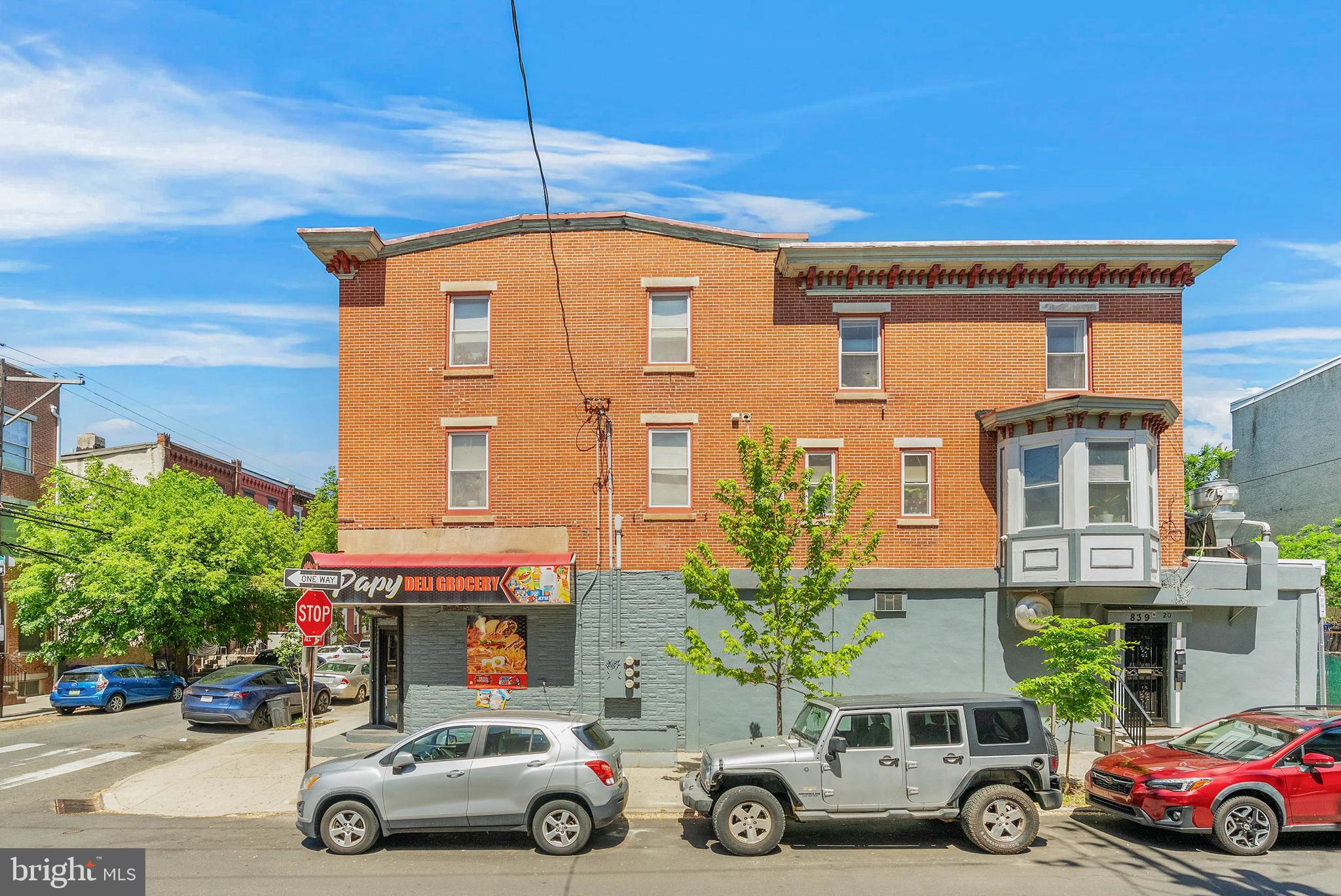 839 N 20th St is a mixed-used, fully-occupied corner property with a commercial space and two 2-bed, 1-bath units located in Philly's sought-after Fairmount neighborhood between Fairmount Ave and Girard Ave. The first level features a convenience store with a commercial kitchen in the rear. This convenience store is a well-established business with years of successful operation and a loyal customer base. The commercial lease for the convenience store extends until June 30th, 2034, and includes 4% annual rent increases. The apartments upstairs are accessed via a private side entrance. Unit #2 has an open main living space with hardwood floors and lots of natural light from bay windows. At the center is a large kitchen boasting a full suite of appliances, including a dishwasher and an island with seating. Down the hall are a full bathroom, a laundry closet, and two spacious, bright bedrooms. Unit #3 has the kitchen, dining area, and laundry closet at the rear. The living room is at the center, with the bathroom and two bedrooms down the hall. 839 N 20th St's fantastic location is steps from popular restaurants, local shops, and sprawling parks. Landmarks like The Philadelphia Museum of Art, Kelly Drive, and The Met are close, as is the Community College of Philadelphia. There's also easy access to public transit, Broad St, I-76, and I-676. Schedule your tour today!