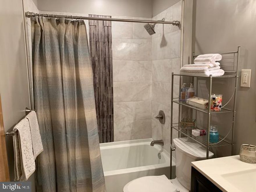 Many new upgrades and finishes on this lovely 3 bedroom home in desirable West Mayfair. This home has many new features including two modern bathrooms with ceramic tile and mosaic glass. Both have new vanities with designer faucets. The kitchen is a large straight through with new electric range, dishwasher, and range hood. The basement features a large living area with a new designer bath and the potential for fourth bedroom in the rear.  Modern lighting and paint throughout this home complete this masterpiece.