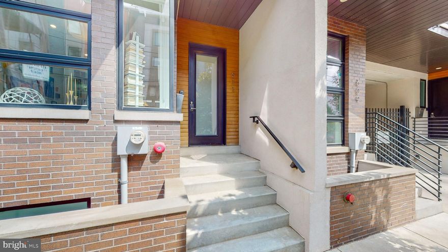 611 N 3rd Street isn’t a house, it’s a private sanctuary in the city with serious Wow Factor!  Constructed as part of eight townhouses in 2016, with multiple upgrades between 2021-2023.  This home has all the features you expect, plus absolute quiet and separation from the city.  Enter through a foyer into the Open Concept first floor–open Living Room - Kitchen - Dining areas, coat closet and a Powder Room. Custom railings with floating full slab treads and brand-new lighting. The cook’s Kitchen features KitchenAid 5-burner stove, built-in oven/microwave, dishwasher, Bosch refrigerator, floor-to-ceiling Pantry, custom Linea Quattro Italian cabinets, quartz countertops with waterfall island, and a custom leather banquette, plus a convenient deck off the Kitchen for outdoor dining complete this floor with panache!  The cars and pedestrians, and local construction rarely are heard through the solid construction of the house. The lower-Level Den with a Powder Room, coat closet, and storage make it flexible for your needs–tv room, gym, kids’ playroom, guest room– access to your TWO CAR GARAGE with storage shelving.  You can configure the garage for one car with additional storage or fit two small cars side-by-side. The 2nd floor consists of two ensuite Bedrooms, each with custom Avera closets and refreshed Bathrooms, along with a large walk-in custom linen closet.  You’ll marvel at the lighting from the full wall and floor-to-ceiling windows, along with the cozy front deck.  Brand new stacking washer/ dryer are found in their own hall storage closet. The 3rd floor is a design masterpiece with a dual primary suite that includes two Bedrooms and a large Bathroom.  The main Bedroom sits in the back of the house and is a completely enclosed sanctuary.  The custom built-in storage and dresser combination provides plenty of closets and drawers, as does the fully custom walk-in closet which can be reconfigured to suit your needs.  The newly refreshed primary Bathroom with a brand-new heated TOTO washlet toilet, large walk-in shower, extra-long soaking tub, dual sinks, and linen closet.  Find your entertainment lounge on the 4th floor which has a full projection screen wall, a full Bathroom and a Kitchen that includes a two-drawer Fisher Paykel dishwasher, refrigerator, and sink.  The front Deck off this floor is great for outdoor dining.  Head up one more flight to the Roof Top Deck for the full skyline experience.  You have a full view of Center City and the Ben Franklin Bridge–which means prime seating for fireworks, sunsets, and great outdoor views.  The brand-new roof and new modern tile decking (2023) ensure that your rooftop experience will be second to none.  Please see the attached list of the many improvements.
