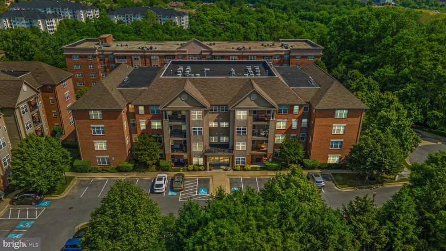 Welcome to 4700 Coyle Road Unit #304 in the Gated Community of Condos at the Ridge! This spacious third-floor unit is thoroughly updated and provides an abundance of space! The hardwood foyer leads to the living room that offers a gas fireplace and a walkout to your private covered balcony! There is a large separate dining room, den, and gourmet kitchen! The kitchen is equipped with 42" white cabinets, granite countertops, a gas range, and stainless steel appliances. The primary bedroom is spacious with a huge walk-in closet and an attached full bathroom with a soaking tub, separate shower, and dual vanities. The second bedroom is also a good size, and the additional full bathroom is just across the hall. The laundry room has a full-size washer and dryer as well. Crown molding! Recessed lights! The elevator, parking garage (with direct access to the garage), and community pools are the cherry on top of this amazing home! Close to restaurants, shopping, the metro, and I 795.  RUN, do not walk! This gorgeous home will NOT last long! FHA approved.