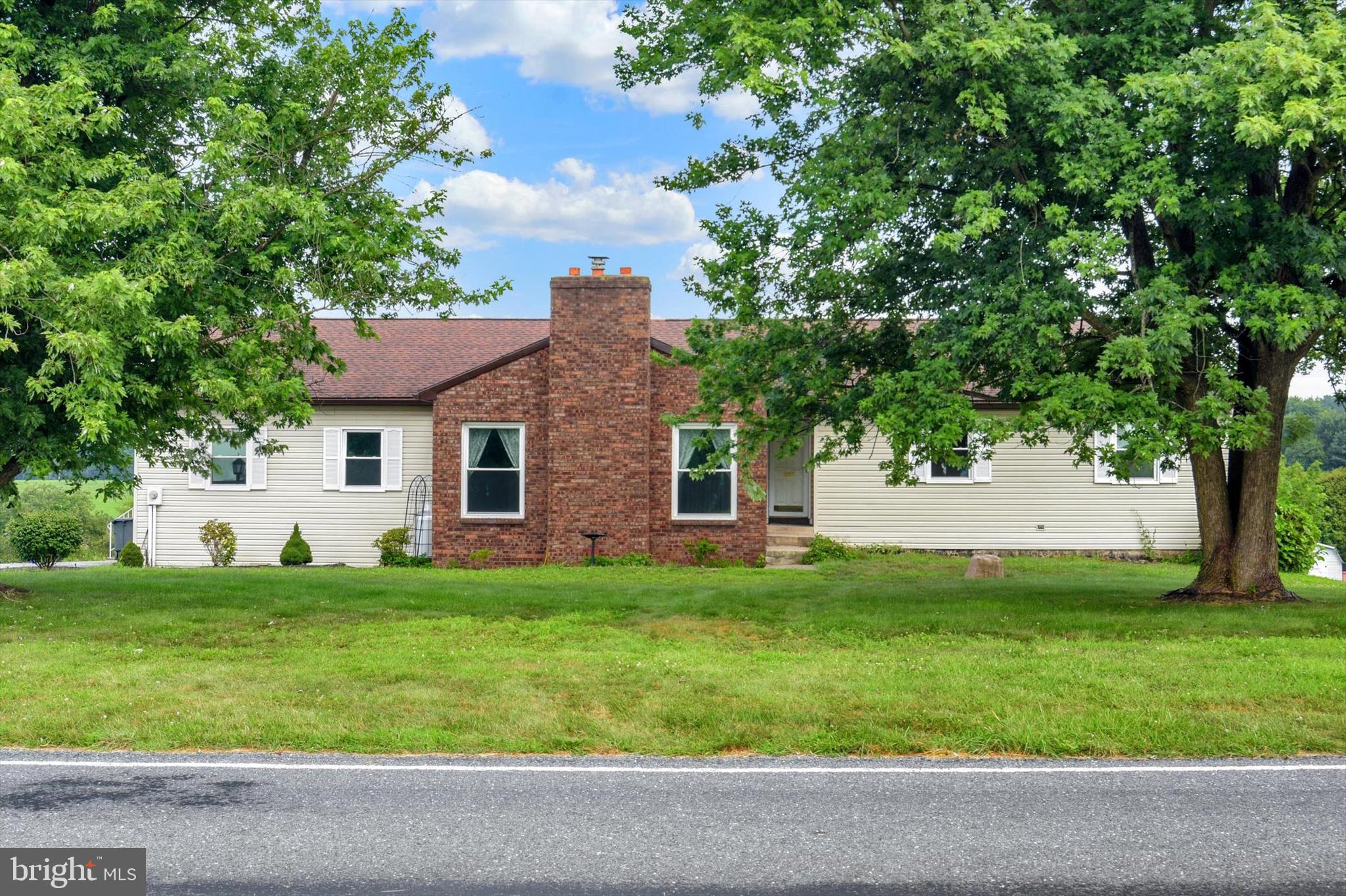 Don’t miss your opportunity to own this spacious raised ranch home, situated on a scenic one-acre lot just outside of Hershey and Hummelstown. The main floor offers an eat-in kitchen with dishwasher, built-in microwave and a pantry cupboard; a sunken living room with 2 skylights and a cozy gas fireplace; four bedrooms; two full baths; and a laundry room including a half bath. One of the two full baths features a double sink and offers private access from the primary bedroom. A hallway closet near the Laundry Room offers additional storage on the main floor. A large composite deck along the back of the home offers a great location for grilling and outdoor dinners. The lower level is an entertainer’s dream offering a huge, finished game room with wet bar, and the entertaining continues as you access the patio and pool area directly out back from the game room. The inground, saltwater pool features a new liner and is surrounded by a lovely stamped concrete patio. Additional spaces in the lower level of the home include a bedroom, half bath, and a number of storage closets. On top of all of these great living spaces, the home offers an attached two-car garage and a spacious detached garage/workshop.
All new doors and windows were installed approximately one year ago. Home is in need of some TLC (missing ceiling tiles/exposed wiring in lower-level bedroom/game room, active leak in roof of detached garage/workshop, dismantled masonry wall in back patio area, etc.). Home is being sold as-is, but the opportunities are endless to make this your dream home!