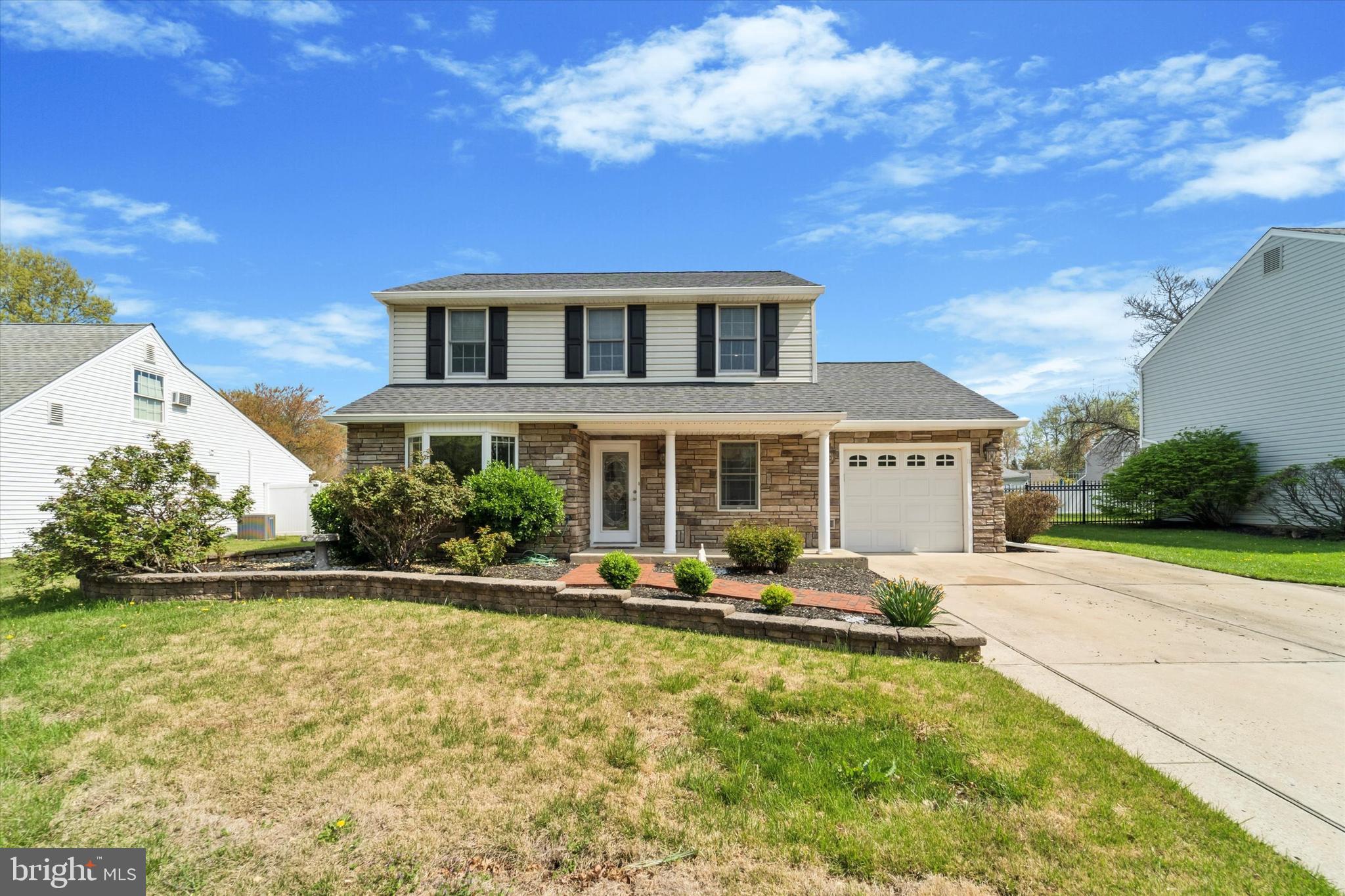 Welcome to this beautifully upgraded and meticulously maintained 3-bedroom, 1.5-bath home in a great neighborhood! Offering fantastic curb appeal, the exterior features a stone front, vinyl siding, a new architectural shingle roof, a doublewide driveway and stone lined flower beds. Inside, a ceramic-tiled foyer welcomes guests and leads to the laundry room and an attached garage complete with attic storage. The updated eat-in kitchen showcases granite countertops, ample cabinetry, stainless steel appliances, custom tiled backsplash and opens to a spectacular vaulted-ceiling family room with a brick accent wall, cozy gas stove, skylights, and French doors to the backyard. An additional sun-filled living space features walls of windows, built-in cabinetry with granite counters and plenty of storage—perfect for entertaining or relaxing. The formal living room includes a large bay window, while the dining room offers a welcoming space for family gatherings and a brick fireplace with wooden mantle. Upstairs, the spacious primary bedroom features a walk-in closet, and the upgraded hall bath includes an oversized shower with seat and modern vanity. Two additional bedrooms with ample closet space. Additional highlights include: Andersen windows and skylights throughout, a two-zone HVAC system, new hot water heater and a fenced rear yard with beautiful paver patio, and two storage sheds. Home is Move-in ready and ready to impress!