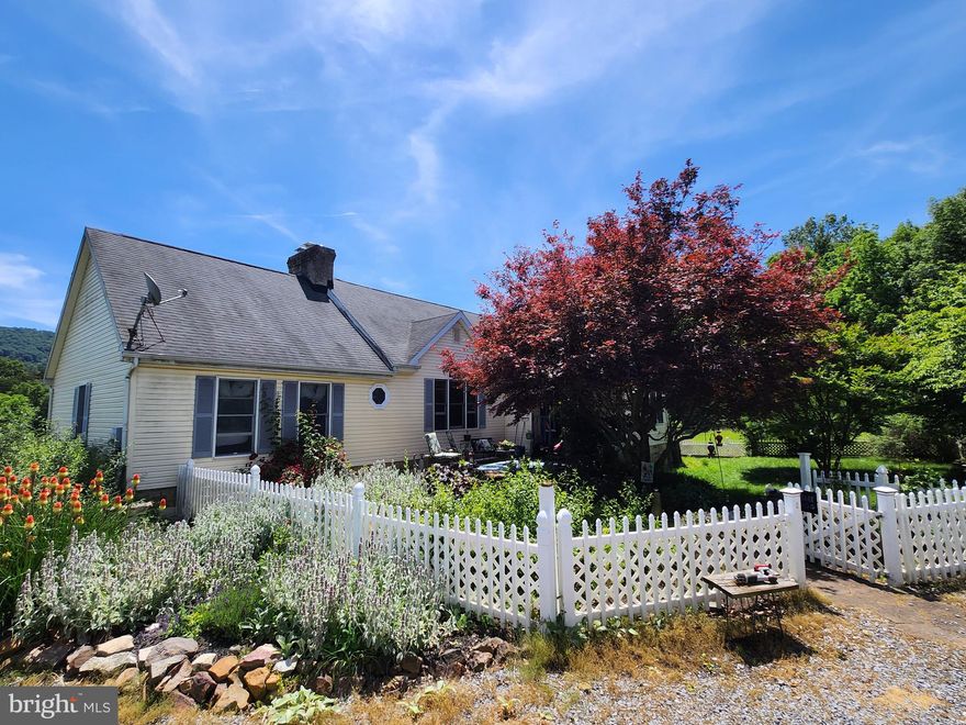 Nestled in the serene landscape of Hedgesville’s Back Creek valley, the property at 14 Riggs Drive offers a unique blend of comfort and freedom. This unrestricted 5+ acre haven boasts a spacious 2600+ sq ft home that invites you to enjoy the tranquility of country living without sacrificing convenience.
Property Highlights:
Unrestricted Land: Over 5 acres of unrestricted land, providing ample space for outdoor activities and gardening.
Spacious Residence: A generous 4-bedroom, 3-bathroom home with over 2,791 sq ft of living space.
Storage Galore: Abundant storage options to accommodate all your needs, from a full, partially finished basement to a 2-car garage.
Stunning Views: Breathtaking mountain vistas that can be admired from the comfort of a 16x20 deck. The perimeter of the house is beautifully landscaped with plenty of deck and patio space for outdoor enjoyment.
Accessibility: Located just minutes from I-81, ensuring easy access to nearby cities and amenities.
Elegant Interiors: The home features a brick fireplace with cathedral ceilings in the living room. Two of the 4 bedrooms have attached bathrooms. There is a possibility of a 5th bedroom in the basement. In addition, the wood stove in the basement provides supplemental heating on those extra cold days.
This property is not just a home; it’s a retreat that offers a lifestyle of peace and privacy. Whether you’re looking for a family residence or a getaway spot, 14 Riggs Drive is a place where memories are waiting to be made. For more details and to experience the beauty, schedule an appointment today.