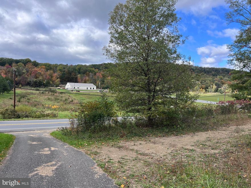 HUGE PRICE REDUCTION!  31 Unrestricted Acres along US Route 522.    LOCATION, LOCATION, LOCATION - Commercial - Residential OR Both - You decide! 536+ feet of road frontage along busy US 522. Public water and sewer available. The property already has a driveway installed and is ready for you to build.  Explore the possibilities of selling off the front acreage along Valley Road and building your home in the back.