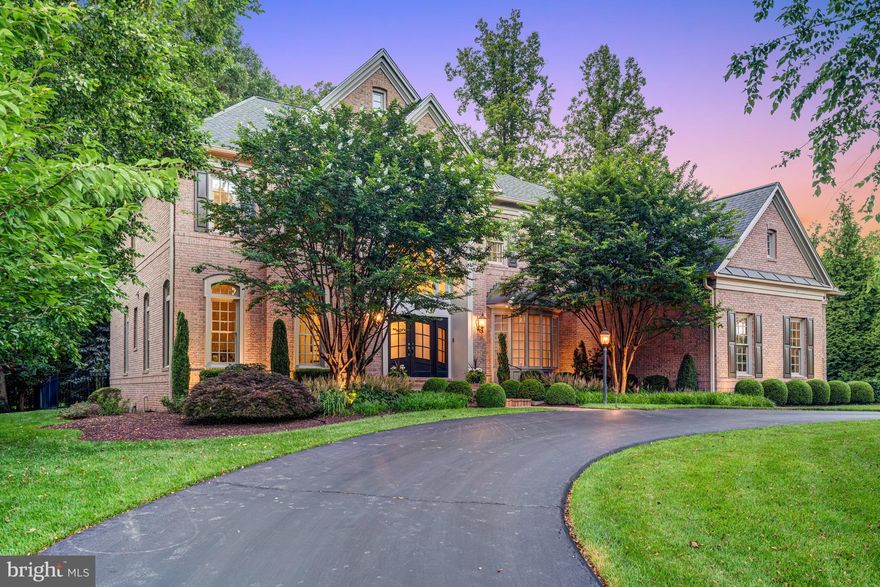 Beautifully renovated with thoughtful design choices throughout, this exceptional home offers 7,300 square feet of finished living space and seamlessly blends luxury, comfort, and modern elegance. Situated on a private lot with a resort-style pool, the residence features soaring 10-foot ceilings on the main level, creating a sense of openness, while wide plank mahogany-stained floors add warmth and sophistication.

The stunning white kitchen, with its oversized island, is outfitted with chef-caliber appliances and designer details, including a foot-pedal faucet for hands-free convenience. The kitchen opens to a spacious family room with a linear stacked-stone gas fireplace, coffered beamed ceiling, and walls of windows that fill the space with natural light and offer a seamless connection to the outdoors.

Step into the inviting screened porch, complete with a striking stone gas fireplace—an ideal setting for year-round enjoyment—which leads to the pool and level rear yard, creating the ultimate private retreat.

The upper level offers five bedrooms and four full bathrooms, including a luxurious owner’s wing featuring two redesigned cedar-lined closets and a spa-inspired bathroom with heated floors, a marble accent wall with a spillover faucet that fills a freestanding soaking tub—a true touch of everyday luxury.

The walk-up lower level is equally impressive, boasting a custom bar, exercise and  game rooms, large recreational room with fireplace  full bathroom, and generous storage space.

Every detail has been carefully curated in this thoughtfully redesigned home, offering an unmatched lifestyle in a peaceful, private setting.