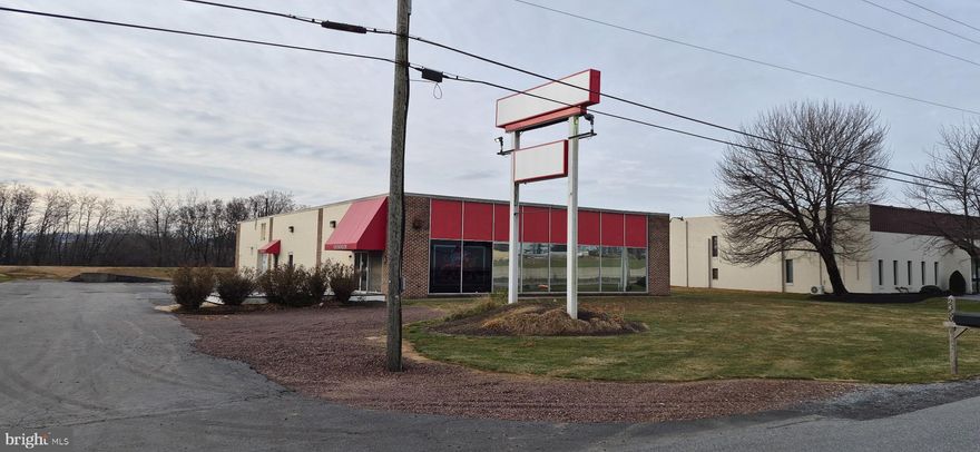 Commercial property with visibility on Route 283. 6,000 sf one story building featuring a showroom/ sales area, two offices, service / parts area, shop/ work area and an additional approximately 1,100 sf addition for storage. Enterprise zoning allows for a variety of commercial uses including auto related businesses, equipment rental, contractor operations, wholesale distrobution, retail sales and service business. Currently configured for auto-related businesses. Easy access. Signage with visibility on Route 283. 15 space parking lot with additional land for outside storage. NNN lease, in addition to base rent, tenant will br responsible for all pass through NNN fees.