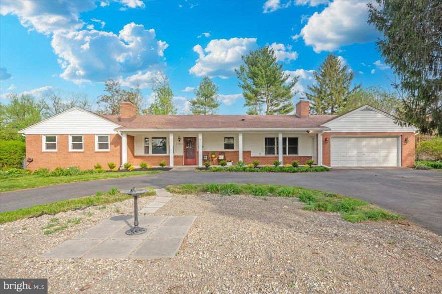 Front porch charm for this expanded rancher with two primary bedrooms.  This home is ready for the lucky new owner with beautiful hardwood floors, new carpet and freshly painted interior.  Updated kitchen, separate dining room, oversize family room with wood-burning fireplace, living room with another wood-burning fireplace and bookshelves, main level laundry room and oversize all-season Sunroom.  Four bedrooms (two primary) and three full baths on this level as well.  Fully-finished lower level with large recreation room with another wood-burning fireplace, craft room or office, half bath and storage.  Circular driveway and 2 car garage.  Beautifully landscaped and a rear deck for outside enjoyment.  Roof approx. 10 years. septic pumped this past Fall, HVAC systems serviced annually.  There is full tank of oil for the new owner.  No HOA.  CINCH Home Warranty.  Fantastic Damascus location...right outside of town and not far from Jimmie Cone!!  OPEN SUNDAY, 4/19, 1-3PM!