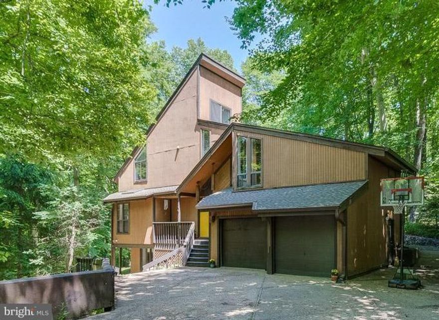 OPEN HOUSE - SUN, JUNE 3RD 1-4 One-of-a-Kind Floor Plan on Private, Wooded, One Acre Lot!  Freshly Painted, New Wood Floors, New Roof, Updated Bathrooms! Multi-Level Open Floor Plan with Bedroom on Basement Level with 1/2 Bath, Upper-Level Master with Ensuite AND Bedroom with Bedroom Loft, Fireplace w/ Conversation Pit, Sunroom/Spa Room w/ Sauna, Large Windows and Skylights. Unique Must-See-Home!!