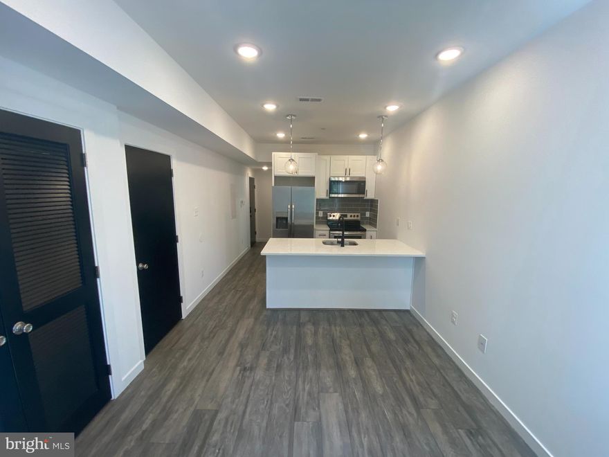 Introducing a stunning 1 bed / 1 bath apartment nestled in the vibrant Cobbs Creek neighborhood of West Philadelphia. This newly constructed building boasts contemporary elegance with its modern finishes, stainless steel appliances, and quartz countertops complemented by a stylish tiled backsplash. Enjoy the convenience of central A/C, stacked in-unit washer and dryer, e-keypad access, and an online tenant portal for seamless payments and maintenance requests. Experience the epitome of comfortable, modern living in this exceptional rental opportunity.