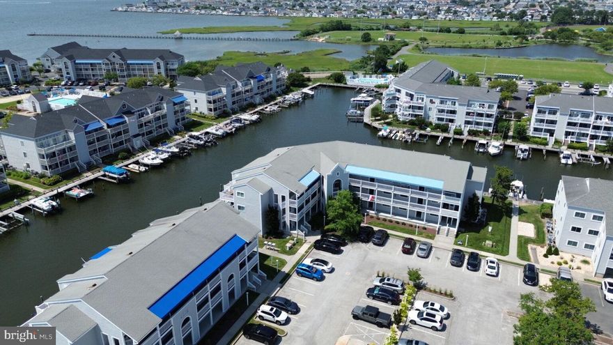 Canal front with fantastic open view towards the Northside Park in north Ocean City, MD shows like new. It was completely remodeled to achieve a fresh and impeccably clean look.  All kitchen appliances were replaced with Stainless Steel  in 2019. The water heater in the bedroom closet and the stack washer and dryer in the hallway closet were replaced in 2019.  Luxury Vinyl Plank flooring was installed in January 2019.  The storage shed on the balcony has been freshly painted and is large enough for all your beach toys and umbrellas. The beautiful outdoor pool is situated on the wide canal between Buildings L and M.  Residents can enjoy watching the fireworks from their balcony which offers wide open views across the water to 125th Street and the Ocean City Community Center.  Additionally, the property is located one block from Northside Park, where numerous year round activities are available for all ages in all seasons are offered. Both residents and visitors are welcomed. There is a rental restriction in Hidden Harbour Phase III -- no rentals less than 30 days. The 5 year study has been completed. Seller will consider a partial concession for Special Assessment.