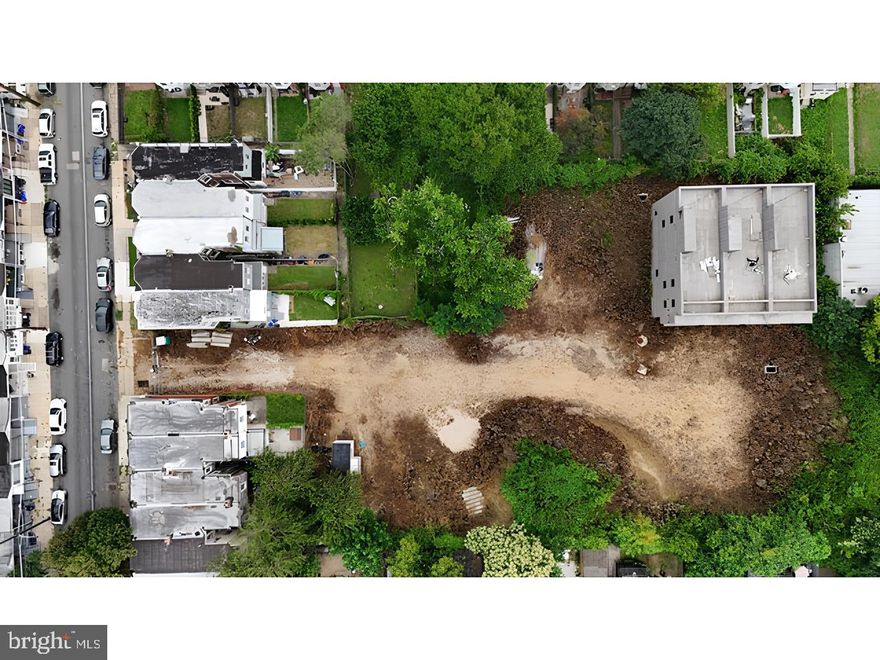 Once envisioned as a thoughtfully planned townhome community known as Mount Airy Mews, 122 E Hortter St offers a rare opportunity to reimagine nearly 0.87 acres in the heart of East Mount Airy—a neighborhood known for its historic architecture, cultural richness, and walkable charm. Prior concepts included up to 19 residential units, with garage parking, rooftop terraces, and modern design features. While any prior approvals or permits would need to be independently reviewed and confirmed, the groundwork of vision and potential is unmistakable. Zoned RSA-5 and set back from the street, this parcel is ideally positioned just steps from the vibrant Germantown Avenue corridor, where cafés, boutiques, restaurants, and cultural institutions help define one of Northwest Philadelphia’s most beloved communities. With close proximity to the Chestnut Hill East Regional Rail line, multiple bus routes, and Wissahickon Valley Park, the location offers lifestyle, convenience, and long-term upside for developers or visionaries seeking to bring new life to a landmark project. Buyers are encouraged to conduct their own due diligence regarding zoning, permitting, and use potential.