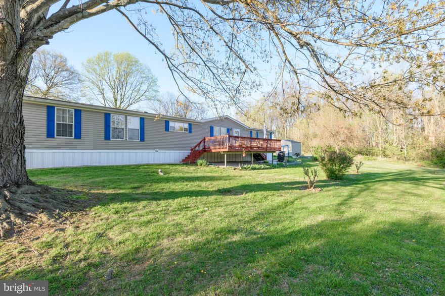 Welcome to this beautifully maintained 4-bedroom, 2-bath manufactured home, ideally situated on leased land in a picturesque community in Nottingham. This spacious Astro 76' x 28' home offers quality living in a desirable setting, with a perfect blend of comfort, space, and thoughtful updates throughout.

From the moment you step inside, you’ll appreciate the expansive living room featuring a cathedral ceiling, creating a bright and open atmosphere. The large eat-in kitchen is well-appointed with oak cabinetry, a pantry, Whirlpool appliances, built-in microwave, flat-surface cooktop range, built-in dishwasher, and a double-bowl stainless steel sink positioned beneath a window overlooking the front yard. A sunny breakfast area enhances the space—perfect for both everyday living and entertaining.

The inviting living room also features a cozy corner wood-burning fireplace with a classic oak mantel and provides direct access to an expansive deck—ideal for relaxing or hosting guests.

The spacious owner’s suite offers a comfortable private retreat, complete with a sitting area, walk-in closet, and an updated en-suite bath featuring a beautifully designed, easy-access walk-in shower. Three additional bedrooms are generously sized and are serviced by a full hall bathroom with a convenient tub/shower combination.

A rear-entry laundry/mud room adds everyday convenience and functionality.

Additional highlights include brand-new carpeting throughout and numerous recent updates, including an HVAC system installed approximately five years ago. This home has been exceptionally well maintained and is truly move-in ready.

Step outside to enjoy peaceful surroundings on a generously sized lot with scenic wooded views perfect for outdoor relaxation or gatherings. A utility shed with overhead storage provides ample space for tools and seasonal items.

Community Details:
Buyer must be approved by park management. Lot rent is $670 per month and includes trash removal. Water and sewer are billed based on usage.