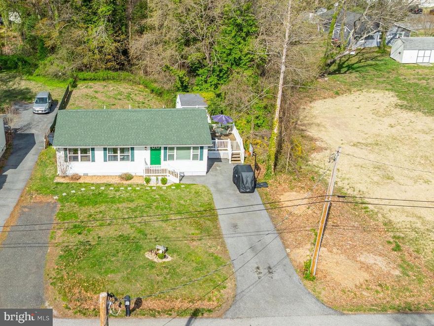 This beautiful rambler in well established  Hollywood Shores is the one that welcomes you HOME!
A private lot backs to woods for added privacy and double driveways insures lots of easy access parking. Once inside you will treasure that the large living room and kitchen give lots of living space and the bedrooms are quietly tucked down a modest hallway. The luxury interlocking maintenance free flooring covers all high traffic areas and the easy access laundry area makes cleaning a breeze! An open area, enclosed backyard is useful for entertaining, pets, or just a quiet evening taking in the serene sounds of nature. The spacious outdoor shed offers generous space for creating your own desired use. If dinners al fresco are a favorite, the lovely deck off of the kitchen is perfect. All this is yours pending the owners finding the home of their choosing but flexibility is key and as you will see, they will be there for you! Do not miss this well cared for, reasonably priced peace of Heaven in this close proximity to water yet quick access to major thoroughfares and shopping. This is for sure “The one where you got your dream come true”.