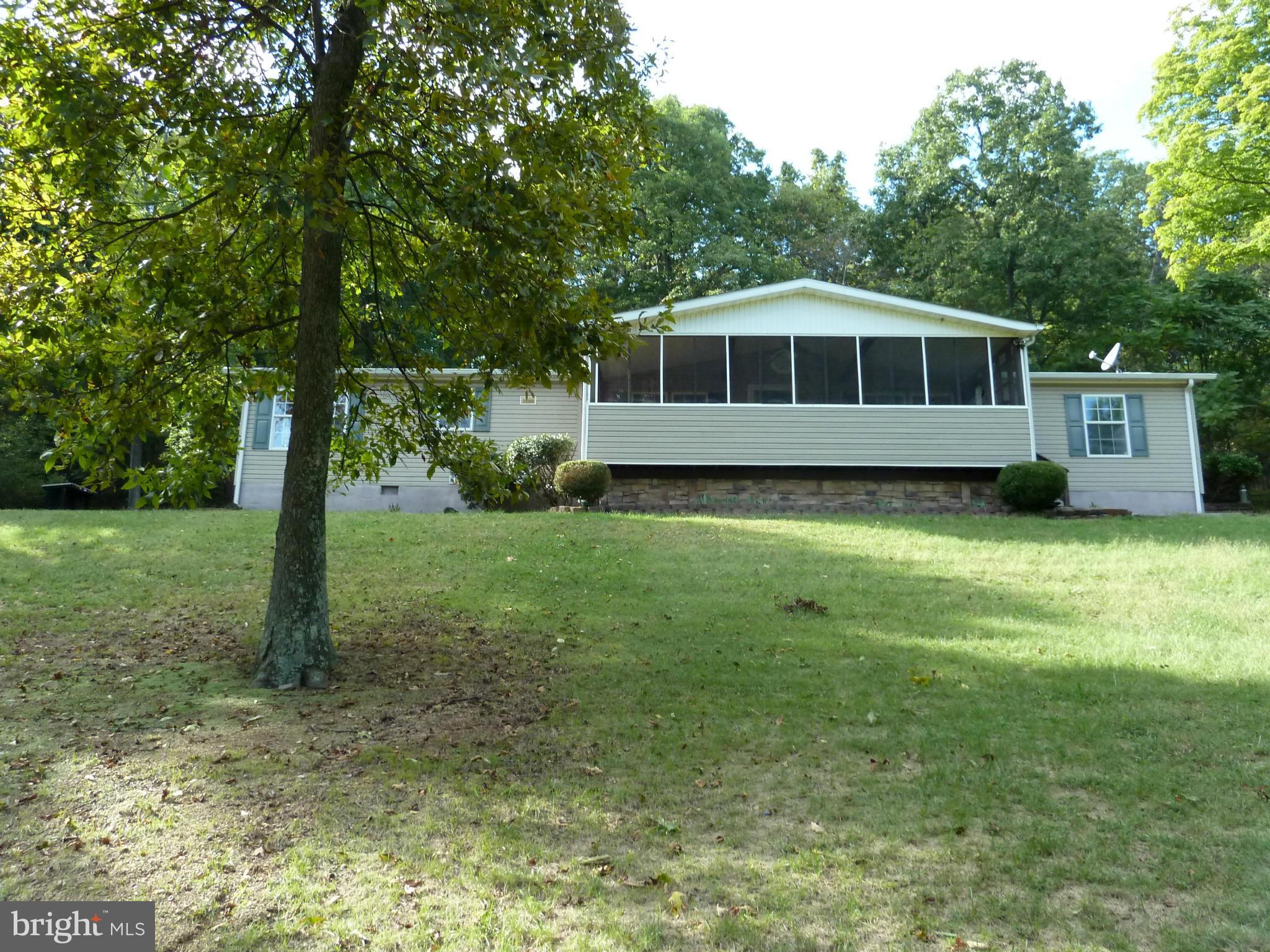 Large double wide home on permanent foundation w/ lovely views of the valley. House needs appliances, repairs including HVAC, flooring, paint, driveway. Could make a lovely home on 2.19 acres of land. Owner occupant offers only until 10/24.Seller paid Home warranty available to owner occupants if requested in the initial offer .Sold as is, all information should be verified by buyers .