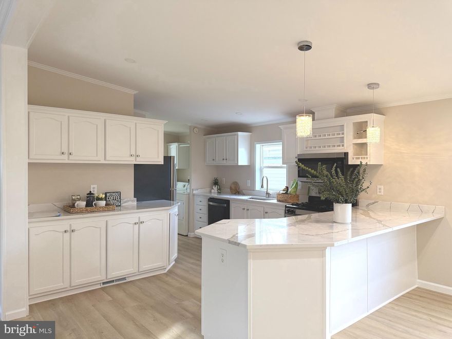 Beautifully renovated 1,352 sq ft 3-bedroom, 2-bath manufactured home located in a professionally managed community in Chantilly. This upgraded home features an open and bright floor plan, fresh interior paint, luxury vinyl plank flooring, and modern finishes throughout. The kitchen includes brand-new stainless steel appliances, marble countertops, and crisp white cabinetry. The primary suite offers a spacious soaking tub and ample storage.