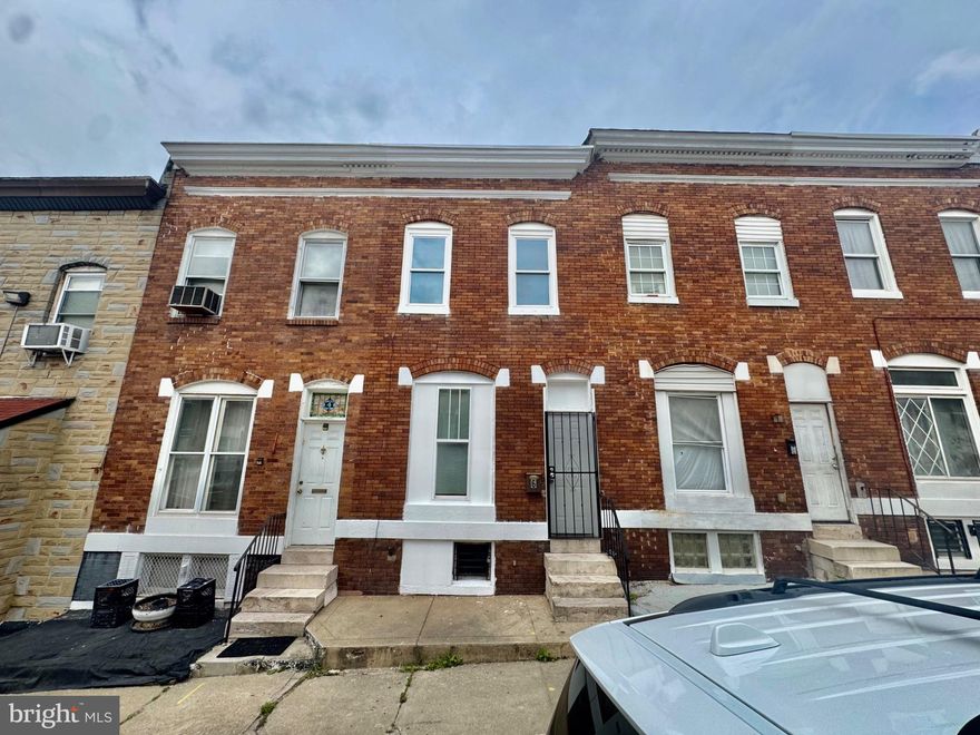 Well-maintained brick rowhome featuring fresh paint on both the exterior front and throughout the interior. The main level offers a convenient full bathroom and bedroom, ideal for guests or added accessibility. The home features luxury vinyl plank (LVP) flooring throughout, along with a new gas range, new refrigerator, and stainless steel microwave. The second floor includes an additional room that is perfect for a home office, study, or flex space. Both bathrooms are equipped with medicine cabinets to maximize storage. All bedrooms include ceiling fans for added comfort. Enjoy the spacious rear patio, perfect for outdoor entertaining or relaxing.
This property may qualify for the Buy Back the Block program and is also an excellent opportunity for investors, as the area qualifies for Section 8 housing assistance.