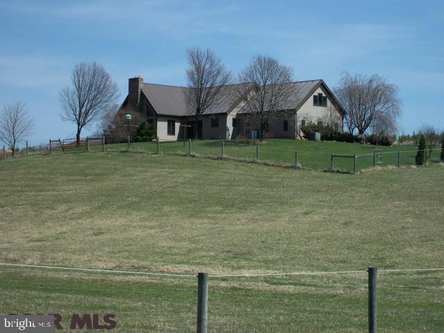 Country living at its finest! You, and your horses will both have spacious, comfortable accommodations. The home includes a central vac, a security system, large walk-in closets, water treatment system, dual heat system and has a steel roof. Windows in the dining area and the great room overlook the pastures and the barn. The barn has 5 spacious horse stalls and one small stall. There are 3 heated watering troughs in the barn and 3 in the pastures. All pastures have electric horse fence and one pasture contains a riding ring.