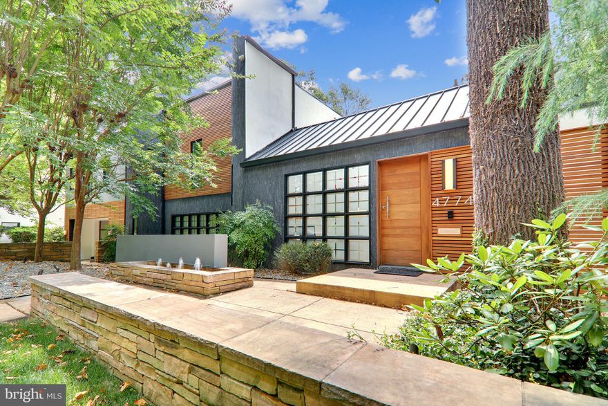 Must see! Rare opportunity to own this renovated, custom California Contemporary gem on one of the most sought-after streets in Wesley Heights/Berkley, steps from Battery Kemble Park. This sun-drenched, serene oasis, perched on a large 13,499 sq ft lot, features spectacular floor to ceiling windows, skylights, and warm hardwood floors. The unique architectural open floor plan wraps around a 27 ft  high Center Atrium, boasting a great room w/ indoor pool, sliding glass wall opening to a south facing lofty deck, outdoor kitchen and sport court. All nestled amongst the lush, mature trees lining the backyard, providing a virtually seamless indoor-outdoor experience ideal for Zen living, entertaining and the perfect "staycation". The main level offers a stylish living/dining room with fireplace. Sophisticated Boffi Kitchen, Miele, Bosch and Gagennau appliances. A panoramic windowed breakfast room, upper deck, spectacular Den, w/built-in library and access to a 2-car garage. The upper level includes 3 large bedrooms with en-suite baths plus a luxurious owner's suite, featuring 3 walk-in-closets and impressive bath with dual vanities. The lower level includes 2 bedrooms, recreation room, and 3.5 bath. The total square footage is estimated at 7600 sq ft or $454/sq ft. You won't find anything like it and will never want to leave home again!