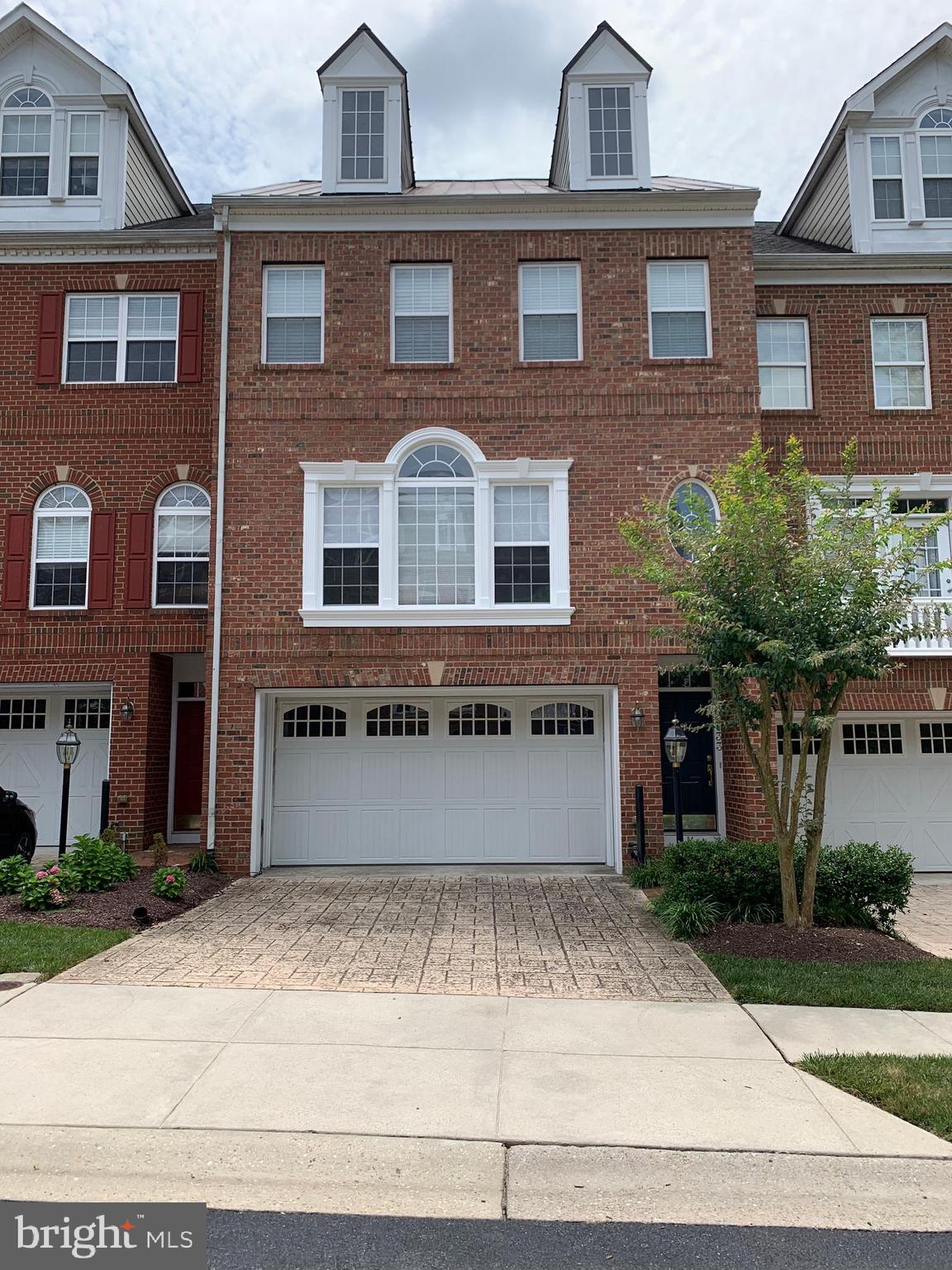 This all-brick townhome in a Gated Community lives like a single family home with over 2770 sq. ft. of living space 3 Bedrooms, 3 Full Bathrooms & 1 Half Bath. 2 car Garage, Large Living & Dining area and Gourmet Kitchen with island and Granite countertops, Sunroom. Gas Fireplace. Hardwood floors, Spacious Primary suite with sitting room, 2 walk-in closets and Large Bathroom with corner Whirlpool tub. Huge walkout family room 1st floor with separate room for office or bedroom and full bath; bedroom level Washer & Dryer. New Flooring. Home backs to trees for lots of privacy from the patio and deck. New flooring. You don't want to miss the opportunity to live in this beautiful well-kept gated community. Yard maintenance is included. No pets. Home is conveniently located close to schools, Annapolis Towne Center, Annapolis Mall and Historic Downtown Annapolis. This Annapolis Maryland location, is conveniently located to Rt 50, 30 minutes from Washington, DC and Baltimore.