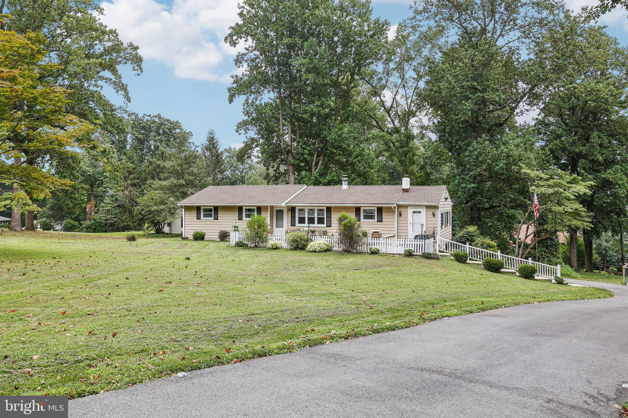 Nestled on a quiet, low-traffic dead-end street, this charming ranch home offers a stunning view of the valley and a peaceful setting to call home. Enter from the spacious front patio and into a cozy living room, where a stone-faced wood-burning fireplace creates a warm, inviting atmosphere. Just beyond, the updated kitchen features stainless steel appliances, granite countertops, a pantry, and a convenient cut-out to the generously sized dining room—perfect for entertaining or everyday meals. A full hall bathroom is tucked away nearby for added convenience. On the opposite side of the living room, you’ll find three spacious bedrooms that share a second full bathroom. The full, unfinished walk-out basement offers endless potential and includes access to the attached one-car garage, as well as a walkout to the private backyard complete with a built-in fire pit. Seller's just replaced the roof in January of 2025! Ideally located just minutes from parks, dog parks, walking, hiking and biking trails, public transportation, shopping, and dining—this home offers comfort, space, and convenience all in one beautiful package. Mortgage savings may be available for buyers of this listing.