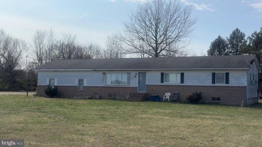 OPPORTUNITY KNOCKS!!  This home is being sold as-is and is ready for someone with vision and a little elbow grease.  Located in Queen Anne's County on Pear Tree Point Rd, the property sits on a generous 2.08-acre lot bordered by farmland on one side of the road, offering peaceful views, and room to breathe.  With wood floors, a spacious living room and a living/dining area, the bones are here -- just bring your ideas and make it shine again. Close to Chestertown while enjoying the benefits of Queen Anne's County living!