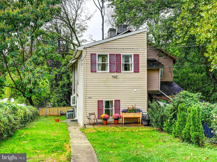 Wonderful opportunity to own a home with large yard, wooded lot, and parking for 1-2 cars in this special enclave of Roosevelt Park by Clipper Mill. The last 3 sales on this block in the last 14 months ranged from $341,000 to $365,000 (1329, 1335, 1337 Clipper Heights). This a row of historic homes that backs up to lots of trees and to Whitehall Mill.  The home was built in the late 1800's and has many charming historic details such has exposed wood beams and uniquely shaped windows. It also has many modern amenities, such as an updated kitchen with stainless appliances, a main floor powder room, skylights, a paved parking pad, and central and minisplit air units. Upstairs has two nice sized bedrooms and a full bath. The home is on a 29+ foot by 148+ foot lot, so lots of space to garden or entertain outdoors. From this home, you can walk to the Avenue in Hampden, the Roosevelt Park pool, playground and skatepark, and towards the Falls to True Chesapeake, Cosima, Birrotecca, La Cuchara, Chuck's Trading Post, Waverly Brewing and more!