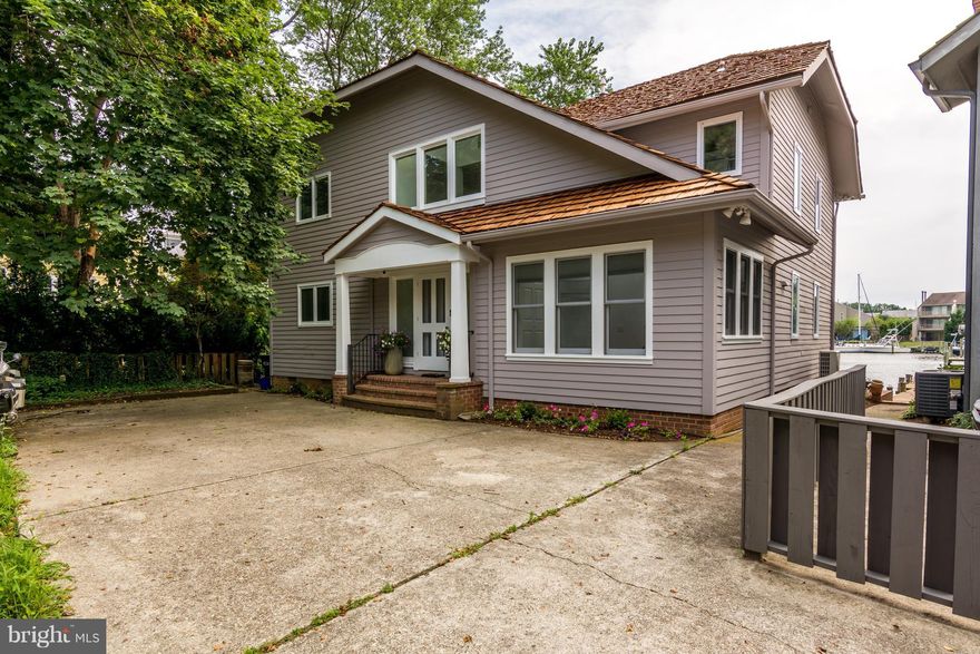 WATERFRONT in Historic.,New kitchen. Stunning baths with gorgeous glass tile. Hardwood floors throughout. Brand new shake roof.Exterior freshly painted. Shared pier with 70 Charles St.. Electric at pier. Built -ins in great room with fireplace. Interior self watering window boxes OFF STREET PARKING FOR 5 CARS. Storage thru rear of house in walk- in crawl space. Great views Spa Crk . Water taxi