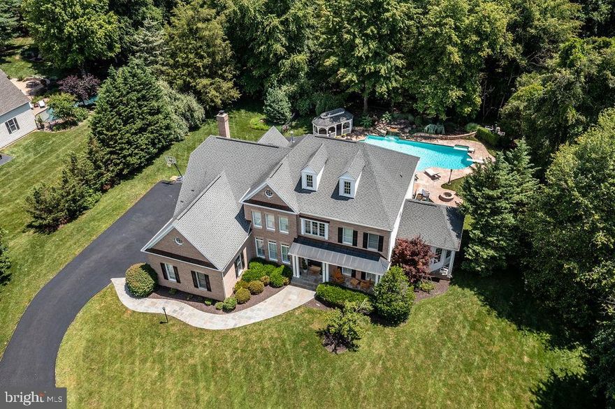 Resort Style Living in Your Own Backyard on Private 3-Acres and Turn-Key Ready! This fabulous property offers a beautiful foyer curved staircase when you enter with a crystal chandelier, 4 large bedrooms includes a guest suite, 4 full remodeled baths, and a half bath, a study with French doors, and a large conservatory, Plantation Shutters on the front of the house because of the bright sun into the home. This home has been completely updated with newer systems throughout and a new roof installed Aug '21. Gourmet Chef’s Kitchen with wine cooler and a walk-in pantry that navigates to the two-story family room that features a full wall stone fireplace with rear staircase. Access from the breakfast and family room area to the pool and a separate 2021 Jacuzzi. Sonos sound system throughout, central vacuum system, 2018 screened sun porch, firepit, large gazebo with ceiling fan and electrical, gorgeous gunite swimming pool with waterfall, stone decking, diving board, and swimmer’s start platform, irrigation system, and 2019 landscape lighting controlled via iPhone. Full walk-out basement that features a wet bar, media room, open recreation area, fitness area, and a full bath. The driveway was paved in June 2021, 3-HVAC units installed April 2021, hot water heater 2021, water softener 2021, washer and dryer 2018, dishwasher 2018, steam humidifier 2019, 2017 basement flooring. Pool table and basketball hoop convey. The interior has been newly painted and ready for you to move in and make it yours!