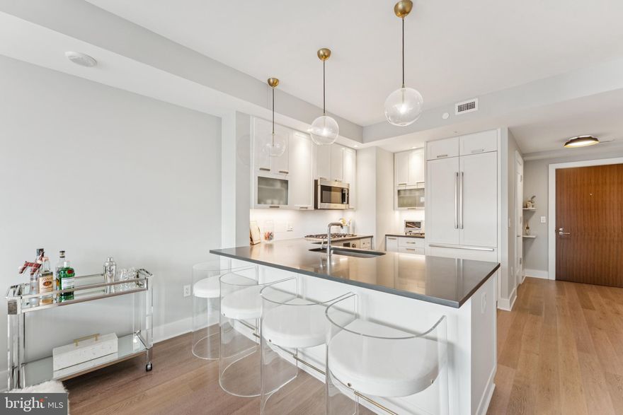 NEW PRICE 4/29 - Experience refined living in this barely-lived-in residence at the coveted Cheval Condominium. Ideally located in the heart of downtown Bethesda, just steps to Metro, the Farmers Market, award-winning restaurants, and premier shopping.

This sun-filled home features an open layout, Bosch appliances, in-unit washer and dryer, spacious closets with custom built-ins, and a private balcony with sweeping city views. Enjoy convenient garage parking and an oversized storage room. Boutique building with concierge, fitness center, and rooftop lounge.

Residents of Cheval enjoy a wealth of amenities, including 24-hour front desk service, separate bicycle storage, a spectacular rooftop terrace with grills, a state-of-the-art fitness center, and an elegant party room for entertaining. Must see!