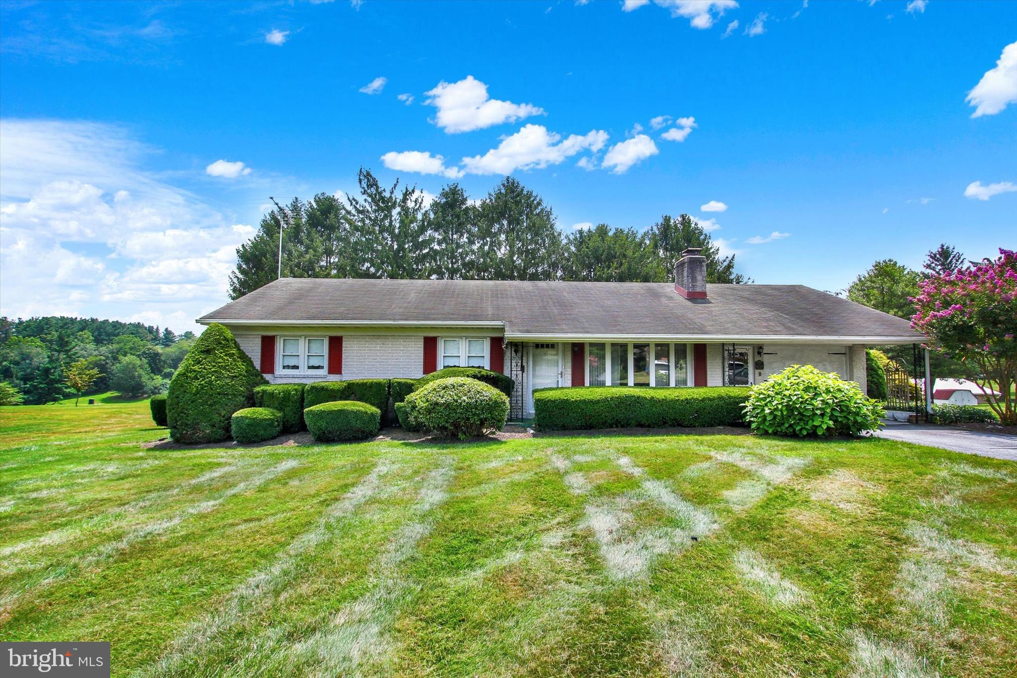 Charming Brick Rancher in Hampstead! Beautifully maintained single-level brick rancher offering comfort, character, and convenience. Nestled on a 0.38-acre lot near the end of a quiet dead end street, this home features 3 Spacious Bedrooms and 2 Full Bathrooms, Covered Front Porch, and Attached 1 Car Garage. Step inside the front door and be greeted by an inviting light filled living room with cozy wood burning fireplace, and gleaming hardwood floors that flow throughout the main living areas. The large kitchen offers ample cabinetry and counter space, and is open to the dining room - great for social gatherings! Downstairs, a finished basement provides flexible space for a home office, gym, or recreation room—plus plenty of storage. There is a laundry shoot and walk up in the rear making easy to move things in and out of the lower level. Home is equipped with Central A/C/Heat Pump adding modern comfort and efficiency to this classic Rancher! OPEN HOUSE FRIDAY AUG 15 TH 5;30-7;30 AND SAT AUG 16TH 12-2