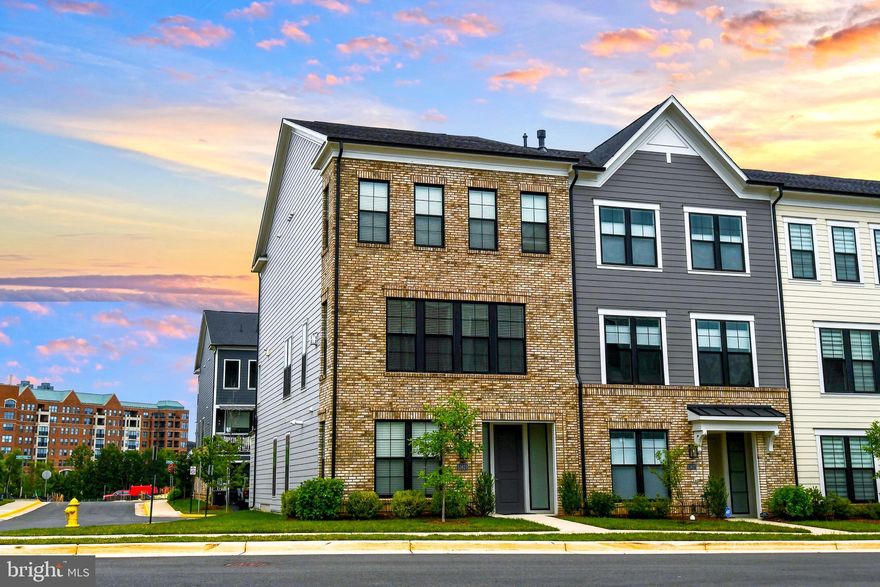 You’ll love living here! Enjoy the Belmont Bay Lifestyle this summer! Walk the marina, enjoy a coffee with friends, take a yoga class, enjoy the community events at the pavilion; you can do it all at Belmont Bay, a picturesque community along the Occoquan River! Welcome to 13825 Estuary Place, part Belmont Bay's Beacon Park Townhome active adult 55+ collection.*** Open to under 55 yo buyers based on 80/20 occupancy rule in HOA by-laws***This end unit townhome built in 2021 is loaded with upgrades and fully accessible with its in-home elevator, wide doorways and hallways, and huge zero entry shower in the primary bath. Hardwood floors throughout all three levels, and so much space to accommodate your living needs. The entry level features a large bedroom, full bath, and living room. The 2 car garage entrance is also on this level. Come home and load your groceries in the elevator, and send them up to the kitchen! On the second level, you will find a beautiful open concept floorplan, kitchen with stainless steel appliances, gas cooktop, a huge island, gorgeous white cabinets, and quartz countertops. The best part…the back wall is almost entirely filled with picture windows that overlook your large back balcony. This level also houses a large dining area and living room with remote controlled gas fireplace. On the third level, you will find an enormous master suite with room for a king sized bed and sitting area, a massive zero entry roll in shower, dual vanity, and a large walk-in closet. This floor also has 2 additional bedrooms (1 is being used as an office), a full hallway bath, and a large laundry closet. The owners spared no expense when selecting upgrades for this home (upgraded interior doors, air filtration system, hydro rail shower column, frameless door zero entry primary bath shower, crown moulding, tray ceiling, recessed lights, under cabinet lighting, Eero home wifi system, security system. .. the list goes on!). Walkable to the VRE, easy access to 95 and shopping, greenspace and community events to enjoy. This home won't last long; schedule your showing today and start enjoying Belmont Bay! Owner will also consider a SINGLE YEAR LEASE/ $4,000 MONTHLY OR MULTI YEAR LEASE/$3,800 MONTHLY.