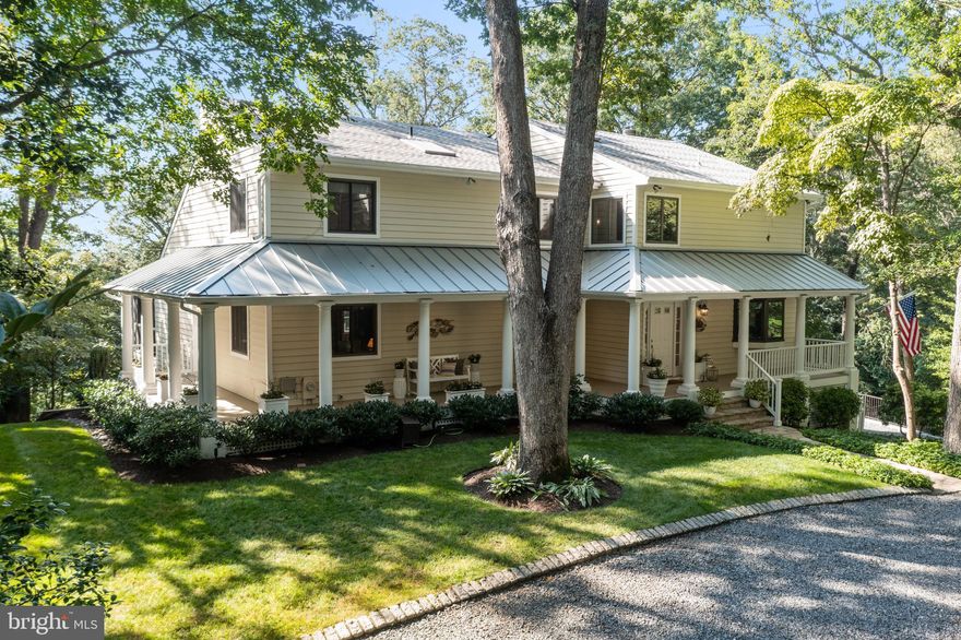 This Severn River waterfront home located at 950 Indian Landing Road is the one you have been waiting for! As you drive down Indian Landing Road, you will immediately feel a sense of tranquility and relaxation. Arriving home, the wrap-around porch and large trees provide a shaded and inviting entrance to the home.

This warm and welcoming home has 5 bedrooms and 4 baths and has been totally renovated and updated-there is nothing to do but move in! The kitchen has been updated with hardwood cabinets, granite countertops and stainless steel appliances and is open to both the living room and family room, both with fireplaces, one gas and one woodburning, and all rooms lead to the back deck and screened in porch- great for enjoying the waterfront or the evening sunset. There is a bedroom and a full bath on the main level, which can be used as a guest room or an office. There is also an additional office with wet bar on the main floor, which is great for working from home.

On the second floor you will find the primary bedroom and bathroom, renovated in 2019 and features vaulted ceilings, heated floors, and a walk-in closet with laundry. Bedrooms 2 and 3 have an adjoining bathroom that was renovated in 2018.

On the lower level, there is a beautifully renovated bed with a bath and an additional family room that leads to the lower brick patio and the waterfront. 3 car garage with electric car charger, whole house generator, alarm system, water purifying system and invisible dog fence are just a few of the many features of this home. A complete list of updates is provided in the disclosures!

Situated on one acre of land, with 80 feet of frontage on the Severn River, the property has been meticulously landscaped with stairs gently leading to the waterfront area, creating a seamless connection between the home and the river. The pier, with a mean low water (MLW) depth of 3-4 feet, is perfect for boating enthusiasts. It features two boat lifts and a double jet ski lift, providing ample space for all your watercraft needs. Hop on your boat and enjoy all that the Severn River has to offer or head 20 minutes down the river to downtown Annapolis to enjoy lunch, dinner or shopping. Take a hike on the Severn Run Trail just down the road. Looking for a community pool or a social club, you can join the Indian Landing Boat Club, a private club within walking distance down the road.

The waterfront patio area is a true oasis, with custom stonework, river rock, and decking. It is the ideal spot to relax and take in the breathtaking views of the Severn River. Whether you want to enjoy a peaceful morning coffee or host a gathering with friends and family, this space offers endless possibilities.

The decks across the back of the house have been recently rebuilt, and the screen porch was renovated in 2021. These additions not only enhance the aesthetic appeal of the home but also provide additional opportunities to enjoy the water views and sunset.

In terms of location, this property offers easy access to major highways such as 97 and 50, making it convenient to reach Washington DC, Baltimore, and BWI Airport. Additionally, its proximity to downtown Annapolis allows for easy access to a variety of dining, shopping, and entertainment options.

Overall, this Severn River waterfront home is a true gem. Its stunning location, meticulous maintenance, and numerous features make it a highly desirable property. Whether you are a boating enthusiast, nature lover, or simply seeking a peaceful retreat, this home offers it all.

Coming Soon July 20, 2023