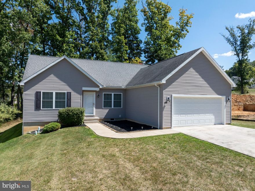 Tour this one-floor living ranch home in the Nittany Grove Community. Perfect for needing a low-maintenance lifestyle or maybe a Penn State retreat!  Located in the Boalsburg area you are just minutes to Beaver Stadium, Tussey Mountain, hiking and lots of shopping and dining.  Inside you are welcomed by a desirable open layout with a large living room connected to the dining room and roomy kitchen. The kitchen boast a large island, quality stained cabinets, built-in appliance's and great storage options. A light filled patio door accesses a stained deck tucked in the trees which makes game-day grilling a breeze! The primary bedroom features a huge walk-in closet and attached bathroom with double sink vanity, walk-in shower, soaking tub, & linen closet. On the opposite side of the home you'll find two additional bedrooms and another full bathroom giving guests or family privacy and separation when needed. A convenient laundry/mudroom is located off of the main living space which enters into the oversized 2-car garage. But the house does not stop there! Head upstairs to the unfinished 2nd floor where you'll find a ton of additional storage space and potential. This space could easily be finished to include another full bathroom, 1-2 bedrooms, and a great room.  This neighborhood also has a monthly association making life and paying bills easy which includes your water, sewer, lawn maintenance, along with trash & recycling pick up.  So if you want a detached home with all the benefits of a condo style living, visit this community now!