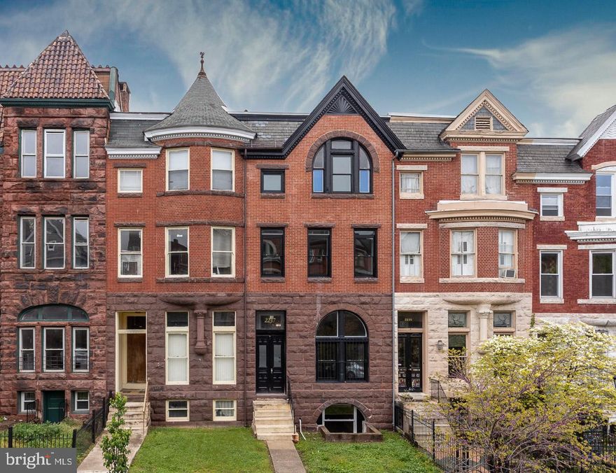 NEW LOW PRICE.     Beautiful tall windows floor to ceiling filled with natural light every turn you make. Beautifully designed main living space for entertaining with 10+ ft. ceilings. Features gleaming hardwood floors on main and Master levels, gorgeous exposed brick staircase leading to the 2 upper levels, crown molding, skylights, tray ceilings; kitchen equipped with stainless steel appliances, wine fridge, gas stove, upgraded counters, breakfast bar with pendant lighting,  backsplash, soft close cabinetry; Master Bedroom with beautiful natural light windows, high cathedral tray ceilings, an extensive walk-in closet, double spacious vanities, a spa like shower, and a separate soaking tub. 4 bedrooms each having its own full bath (you could consider all of the bedrooms Master Suites) and several with walk-in closets, could also be perfect for private office. Basement is a blank canvas waiting for you to make your own, private rear entrance, perfect for a rental or to make your private office, fully finished, wide open, 5th bathroom rough-in. Exterior Features: New front custom wood windows, fenced rear, 2-car parking pad, sidewalks, street lights. New dual HVAC, duct work, electric, plumbing, 2 new sump pumps.