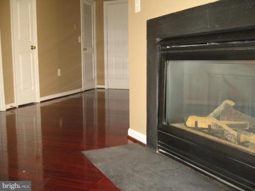 Large condo with two bedrooms and two full baths. Nicely painted and entire wood floor make this a house absolutely move-in ready. Features new gas water heater, range and dishwasher. swimming pool great spot to relax with a cup of coffee. Welcome to the good life!!