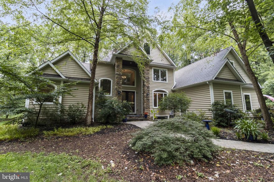 Welcome to 10903 Collinswood Drive!  This picturesque waterside retreat is nestled in the woods bounded by the Choptank River and its Chapel Branch tributary, which accommodates outboard boating. Featuring 4 large bedrooms, 2.5 bathrooms, this immaculate home offers a perfect blend of modern comfort and rustic charm, providing a tranquil oasis. Sited on a 4 acre lot with stunning landscaping, this property promises a serene lifestyle away from the hustle and bustle of the city. Upon entering, you are greeted by a warm and inviting two story living area, enhanced by an abundance of natural light that fills the home. The open-concept design seamlessly connects the living room, dining area, and kitchen, creating an ideal space for entertaining guests or spending quality time with loved ones. The kitchen is a chef's dream, boasting quartzite countertops, ample cabinetry, and a suite of modern stainless appliances, including a 6 burner stove. Whether you're preparing a simple meal or hosting a dinner party, this well-appointed kitchen is sure to meet your culinary needs. The main floor primary bedroom is a true retreat, featuring a generous layout, hardwood floors, gas fireplace, 2 walk in closets, and a spa like bathroom with soaking tub, separate shower and double sinks. Three additional upper floor bedrooms offer comfortable accommodations for family or guests and share a well-appointed bathroom. Two additional spacious upper floor rooms serve as additional family rooms or bedrooms. The versatile layout of this home ensures ample space for relaxation and privacy. Step outside and discover your own private oasis. The breezy screened porch leads to the lovely outside deck and patio. These outdoor living spaces lead to a very special rear yard offering a quiet retreat surrounded by lush greenery, and a waterside dock, with approximately 3’ MLW. Whether you're enjoying a morning coffee on the patio, hosting a barbecue with friends, or simply basking in the tranquility of nature, this outdoor haven is a wonderful extension of the home. Inquire with agent regarding availability of the adjacent 1.55acre lot. Additional features of this unique property include a main floor laundry room, three-car garage, and a large unfinished basement with rough-ins for plumbing and an additional bath. Don't miss this incredible opportunity to own a peaceful Eastern Shore retreat. Denton offers proximity to the numerous restaurants and other amenities of nearby Easton, as well as to the Delaware and Maryland beaches. Come experience the beauty and serenity of 10903 Collinswood Dr for yourself. Welcome home!