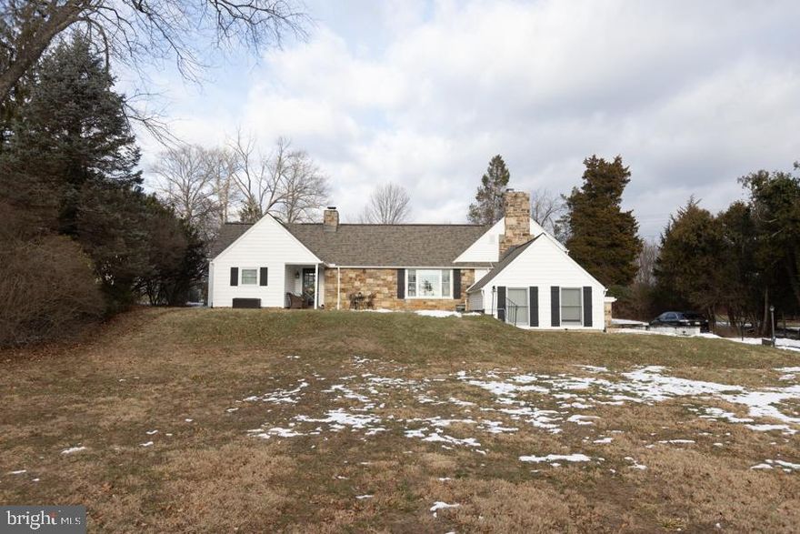 Welcome home to this enormous 4 Bedroom 2.5 bath Raised Ranch located in sought after Flourtown! Very large front and back yard providing luxurious and private outdoor living. Expansive front patio, the perfect spot to enjoy sunsets and al fresco dining. When you open the door you will be delighted to see gleaming hardwood floors in the large living room complete with a picture window, recessed lighting, built in wall shelving and lovely fireplace. The hardwood floors continue into the dining room which adjoins to the kitchen with granite counters, gorgeous cabinetry, stainless steel appliances, wine bar with wine cooler and plenty of counter space and custom granite topped island.  A guest bedroom is located off the dining room that serves as a private retreat for your all of your visitors! Move your way through the living room and onto the bedroom wing where you will find three bedrooms and a hall bath. Each bedroom has plenty of closet space. The primary suite includes a fireplace, lots of closet space, an en suite bathroom and large dressing room. This home also features a large family room with dramatic cathedral ceilings and a fireplace. From the living room or the kitchen, you can head to the back patio that overlooks the private back yard. This home is perfect for entertaining inside or outside. Route 309 and the PA turnpike are a short drive away. Beautiful park across the street! Close to Chestnut Hill and Ambler. Sought after Springfield Schools. Seller is a licensed PA real estate agent.