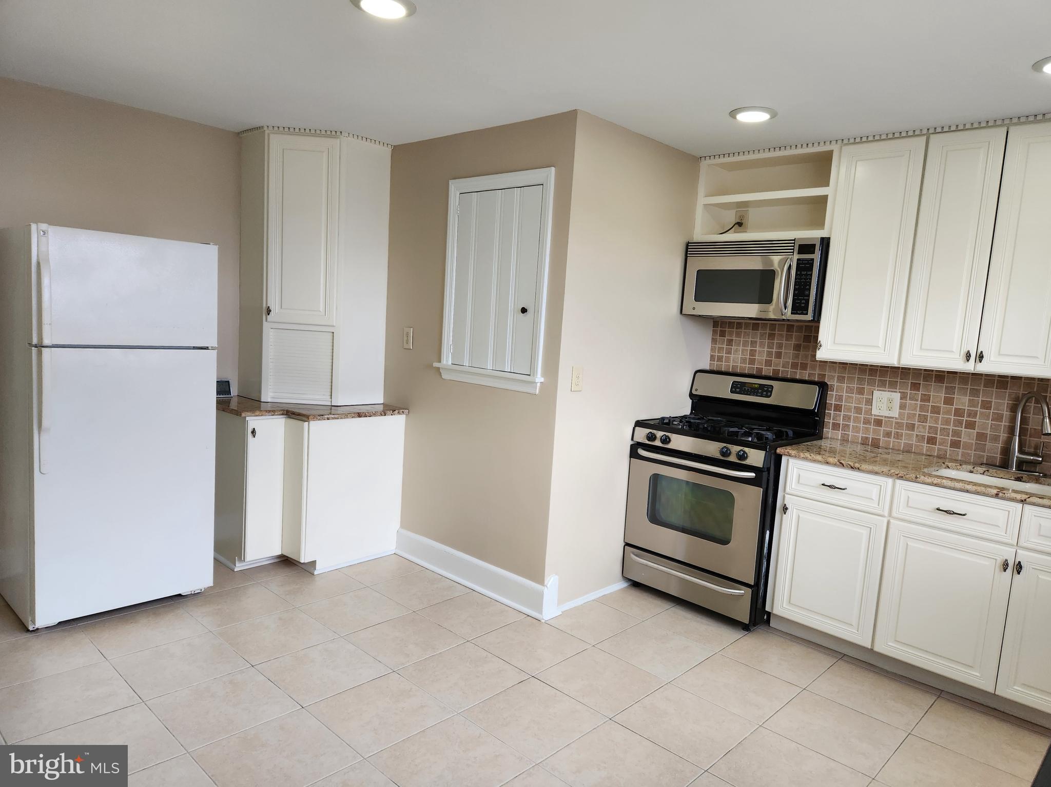 2nd Floor, 2-Bedroom Apartment with Heat & Water Included. Features new carpet, a kitchen with ample cabinet space, granite countertops, stove, refrigerator, and microwave. The apartment includes a spacious living room, full bathroom, washer and dryer, fresh paint, and recessed lighting. Easy to show and available immediately.