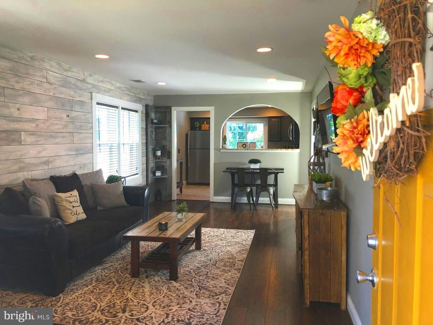 Welcome home! Pull in to either of the TWO paved driveways to serenity and relaxation. From the shady front porch to the peaceful patio in the huge fenced back yard, this is home.  Architectural details, like arched openings and a window seat, can be found throughout the house. Modern decorator touches abound, like a plank wood wall.  Entirely updated over the past four+ years, a half bath and laundry room were added.  The two small bedrooms in the front were merged to make the immense new master bedroom! A large bedroom with dual closets was added in the back of the house.  One story living makes this beautiful bungalow perfect for buyers of all ages and from all walks of life.  Come home to your cozy, carefully renovated oasis.