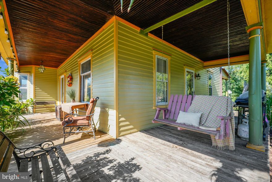 New price! Incredible value for an opportunity to have rare non HOA, small acreage, right in town! You won't find a home in this condition on small acreage AND right in a small town full of restaurants and amenities, parks, etc anywhere else!
See documents tab for features & systems info.
Small acreage, right in town! The Dr. C.E. Foley House — A Victorian Gem in Downtown Lovettsville
2011 Community Blue Ribbon Design Excellence Award for Restoration, from The Loudoun County Joint Architectural Review Board! See interactive floor plans under the virtual tour tab.
Beautiful 4-bedroom, 2.5-bath Victorian blends history, character, and small-town charm. Once home to Lovettsville’s town doctor, the property is a rare find—2.5 acres in the heart of town with a private pond PLUS a separate .3-acre parcel with paid water/sewer tap included in the sale. No HOA and chickens are allowed in town!
Inside you'll be charmed by the soaring 9-foot ceilings and original hardwood floors, oak trim, a leaded glass window, pocket doors, and working original windows. Historic home lovers will notice details like solid oak five panel doors with bullseye door knobs, vintage brass switch covers, and period lighting. A modern kitchen with granite countertops, glass-front cabinetry, and walk-in pantry offers everyday comfort. Spacious rooms, a main-level office, and front and rear staircases add to the home’s appeal. Primary bedroom has an ensuite full bath and walk in closet. Shared hall bath is spacious with a claw foot soaking tub and separate shower. Bedroom 2 and 3 also have walk in closets. Outside, enjoy a deep wraparound porch, slate patio, and custom-painted exterior restored by hand. The siding is American Chestnut, which is naturally rot resistant. Brand new (2025) HVAC! No well and septic, this acreage is on town water/sewer! Oversized gravel parking area behind the home offers plenty of room to build a garage if desired. The old carriage house foundation surrounds the garden area. Xfinity internet makes working from a home a breeze.
From your front lawn, watch the Independence Day parade and fireworks, then stroll, bike, or drive to 10 restaurants, Back Street Brews coffee shop, the Co-op Grocery, library, the 90-acre community park, dog park, Community Center, pool, and more. With festivals, traditions, neighbors who know your name, and many wineries and breweries nearby, this is small-town living at its best.
The original portion of the home is c1899. A rear addition was added by the doctor c1920 to expand the living space. Dr. Foley welcomed patients from the side entrance that opened into his waiting room (now the laundry/mud room). The main level office is currently used as a 5th bedroom.

It's more than a home, it's a piece of Lovettsville history.   Want a garage?  You can get a renovation loan to finance the construction of your dream garage! Contact agent for details.