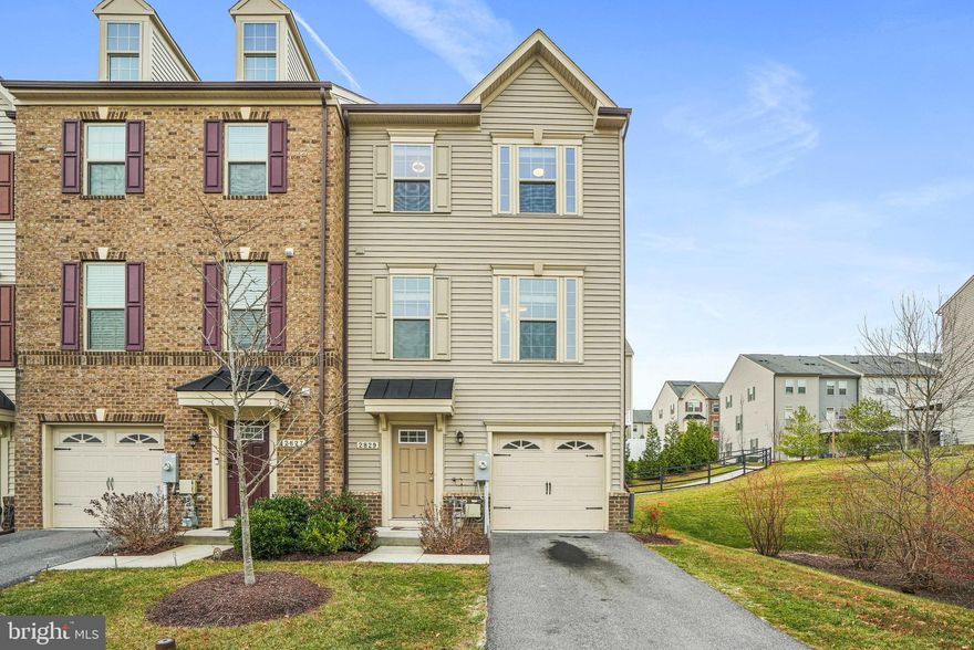 Welcome home to this beautifully designed end-unit townhome offering over 1,900+ square feet of finished living space in the highly sought-after Parkside community—where modern comfort meets effortless living. Positioned for added privacy and flooded with natural light from additional windows, the main level showcases an open-concept floor plan with impressive 9-foot ceilings, perfect for both everyday living and entertaining, and features a gourmet kitchen with 42" cabinetry, ample granite counter space, stainless steel appliances, and an oversized island. The kitchen flows seamlessly into the dining and living areas, enhanced by elegant engineered wood flooring, ideal for intimate dinners or cozy movie nights, and a convenient powder room completes this level. Step outside onto your private deck and enjoy relaxing evenings under the stars. Upstairs, retreat to the spacious owner’s suite featuring a walk-in closet and a luxurious private bath with dual vanities, a soaking tub, and a walk-in shower. Two additional generously sized bedrooms and a full hall bathroom provide flexibility for guests, a home office, or growing needs, while the thoughtfully located upper-level laundry adds everyday convenience. The lower level welcomes you through the garage into a spacious foyer leading to a versatile recreation room, perfect as a family room, home gym, or flex space. Enjoy the ease of a low-maintenance yard with minimal grass to cut, along with access to Parkside’s exceptional amenities including a community center, pool, fitness center, playground, and dog park. Conveniently located near shopping, dining, and major commuter routes with quick access to Fort Meade, BWI, I-295, MD-32, and MD-100, this home truly offers the lifestyle you’ve been waiting for.