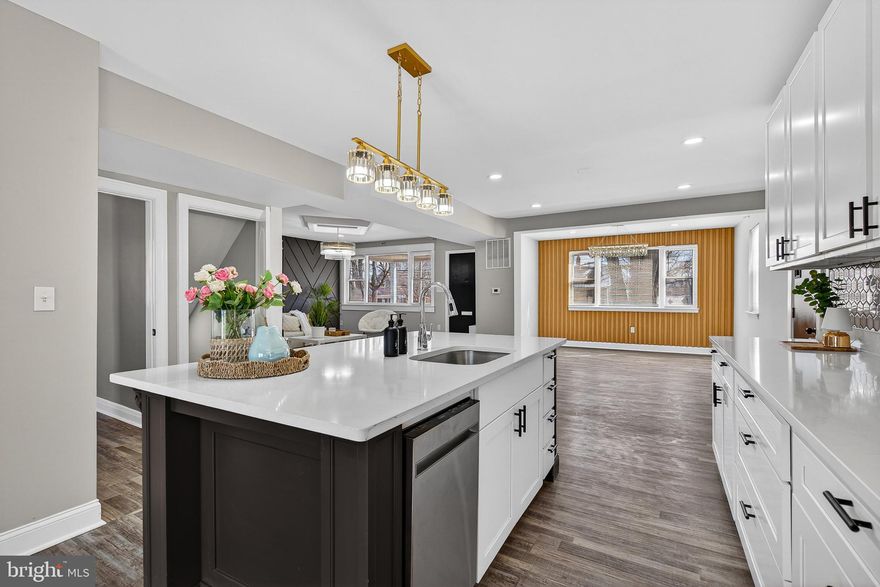 Welcome to this absolutely stunning, fully renovated single family home, where classic exterior charm meets cutting-edge contemporary design. Perfectly nestled on a tree-lined street in an established neighborhood, this property offers a turn-key lifestyle defined by premium finishes, a versatile layout, and an ideal location.
Step inside to discover a bright, airy, and expansive open-concept main level. The home's sophisticated aesthetic is set by the designer neutral palette, featuring modern gray walls, crisp white trim, and gorgeous wide-plank, gray-toned Luxury Vinyl Plank (LVP) flooring that flows seamlessly throughout. Recessed lighting brightens every space, highlighting the impeccable renovation. The heart of the home is a chef’s dream kitchen. Elegant white shaker cabinetry provides abundant storage, beautifully contrasted by a large, substantial dark gray/black center island with classic carved details and comfortable bar seating. White, subtly veined quartz countertops and a chic hexagon tile backsplash create a polished look.
The kitchen is completed by a full suite of stainless steel appliances, including a modern gas range and French-door refrigerator.
The home offers well-appointed bedrooms across multiple levels, including the inviting main-floor bedrooms and highly versatile rooms under the roofline with stylish angled ceilings on the upper level. All full bathrooms are brand new and feature a modern, luxurious feel. Showers are encased in bright, large-format marble-look tiles for a spa-like retreat. Brand new vanities, modern lighting, and pristine white fixtures complete the clean, contemporary aesthetic.
The exterior is equally appealing, starting with the handsome, gray-painted bungalow exterior and a welcoming covered front porch—the perfect spot for morning coffee. In the back, sliding glass doors open onto a newly built wood deck and staircase, leading down to a large, level backyard. The yard is fully enclosed with a mix of a white privacy fence and chainlink, offering a great space for recreation and relaxation, plus a storage shed for yard equipment. This renovated property offers the rare chance to enjoy the quality and style of new construction combined with the character of an established neighborhood. It’s an ideal setting for those seeking a sophisticated, move-in-ready dream home. Don't miss the opportunity  to become the owner of this amazing home and schedule your showing today!