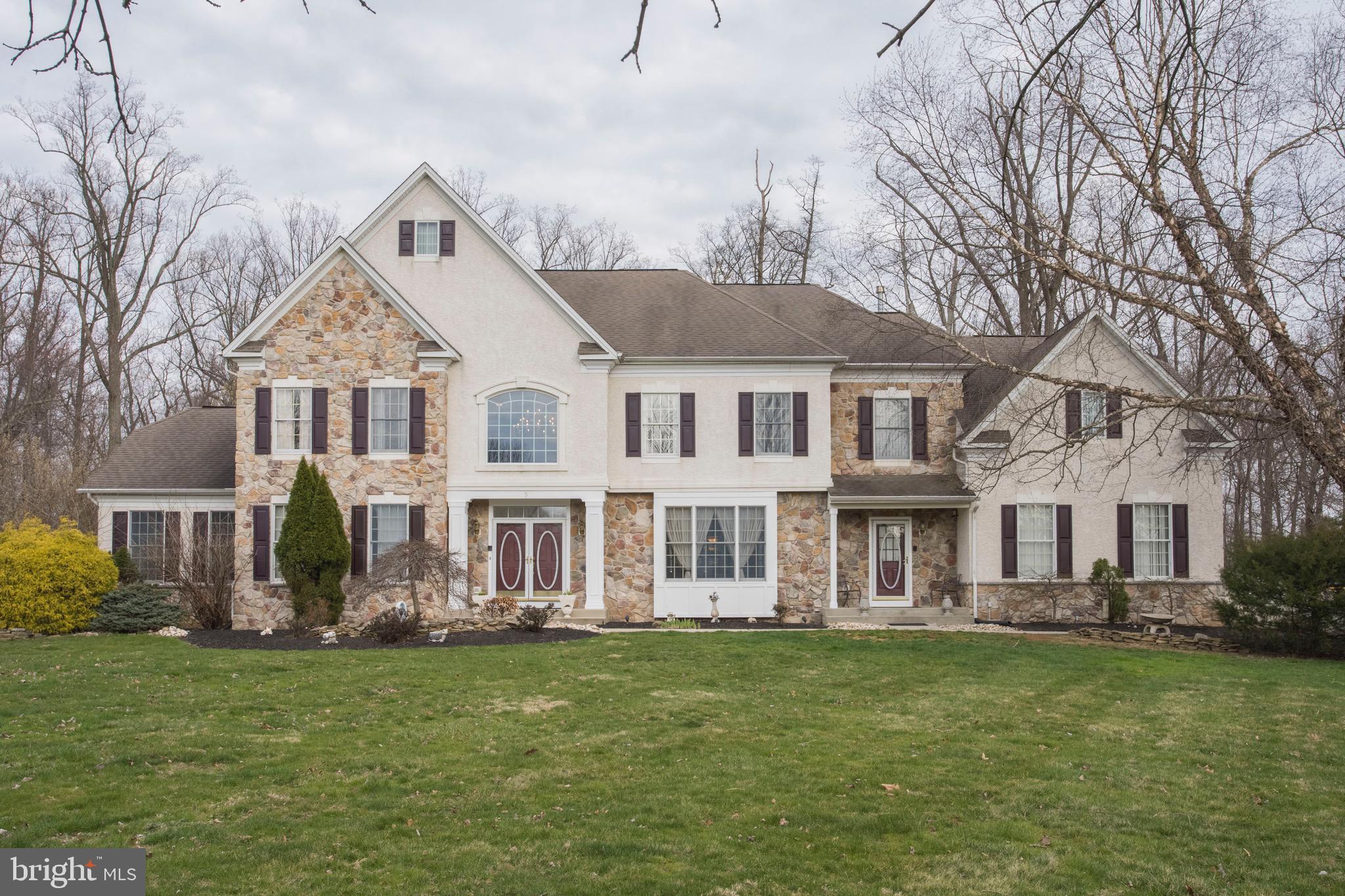 Located in beautiful Newtown Township, Bucks County Pa. This elegant Colonial style home is just minutes from all shopping in Newtown, and major Highways. This property has a wide driveway that leads to a oversized 3 car Garage with lots of storage space. The main entrance opens into a lovely 2 story Foyer, a winding staircase and marble tile floors. A formal sitting room, Formal Dining Room both complete with Crown Molding, Wainscoting/shadow boxing. Two sets French doors open to a spacious Sunroom. A large Living room with a wall of windows and a Fireplace, clad with stone from floor to ceiling. A second entrance enters into the mud room/ wash room. A large open Kitchen with informal dining room and breakfast nook, complete with appliances, Cherry Cabinets, granite counter tops and a large center Island. The main floor has a Half Bathroom and an extra room that can be a first floor bedroom or perfect for an office. The second floor has 4 bedrooms and 3 full bathrooms. The Master Bedroom, with walk in closets, vaulted ceiling and a sitting/dressing room, is anything but small. The master bathroom has a double Vanity, jacuzzi soaking tub and large walk in double shower with two shower heads and a built in bench seat. Shower also doubles as a steam room. The 2nd Bedroom has a walk-in closet and on suite full bathroom. Bedrooms 3 and 4 are joined by a Jack n’ Jill full bathroom. This home also boasts a fully finished and upgraded 2000sq ft Basement. Hardwood floors in main open area, and carpet elsewhere. A large Theater Room, perfect for movie nights and or sporting events with a 119” screen and 4K 3-D compatible projector, also a surround sound system. Separated from the rest of the basement are extra rooms which could be an in-law suite, guest rooms, etc. 3 rooms and a full tub/shower bathroom. Currently, 2 rooms are used as bedrooms and one for storage. Not only is it the largest lot in Pickering Chase at 2.66 acres, this premier home has the most square footage in Pickering Chase as well. This is a must see, beautiful home in an a near perfect location.