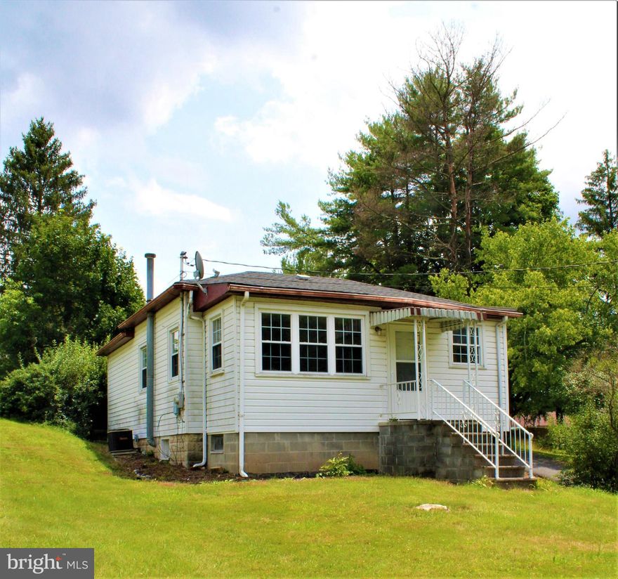 CHARMING JUST OUTSIDE THE CITY - THIS HOME IS MOVE IN CONDITION FEATURING NEW FLOORING - NICE SIZE ROOMS -HOME FEATURES A 16X12 COVERED PATIO WITH WALKOUT LEVEL THROUGH PATIO DOORS FROM THE KITCHEN - DETACHED 1 CAR GARAGE WITH ATTACHED STORAGE - HOME FEATURES REPLACEMENT WINDOWS - ALL SITUATED ON A .48 LOT WHICH IS CONVENIENT YET PRIVATE.  CENTRAL AIR, FULL BASEMENT