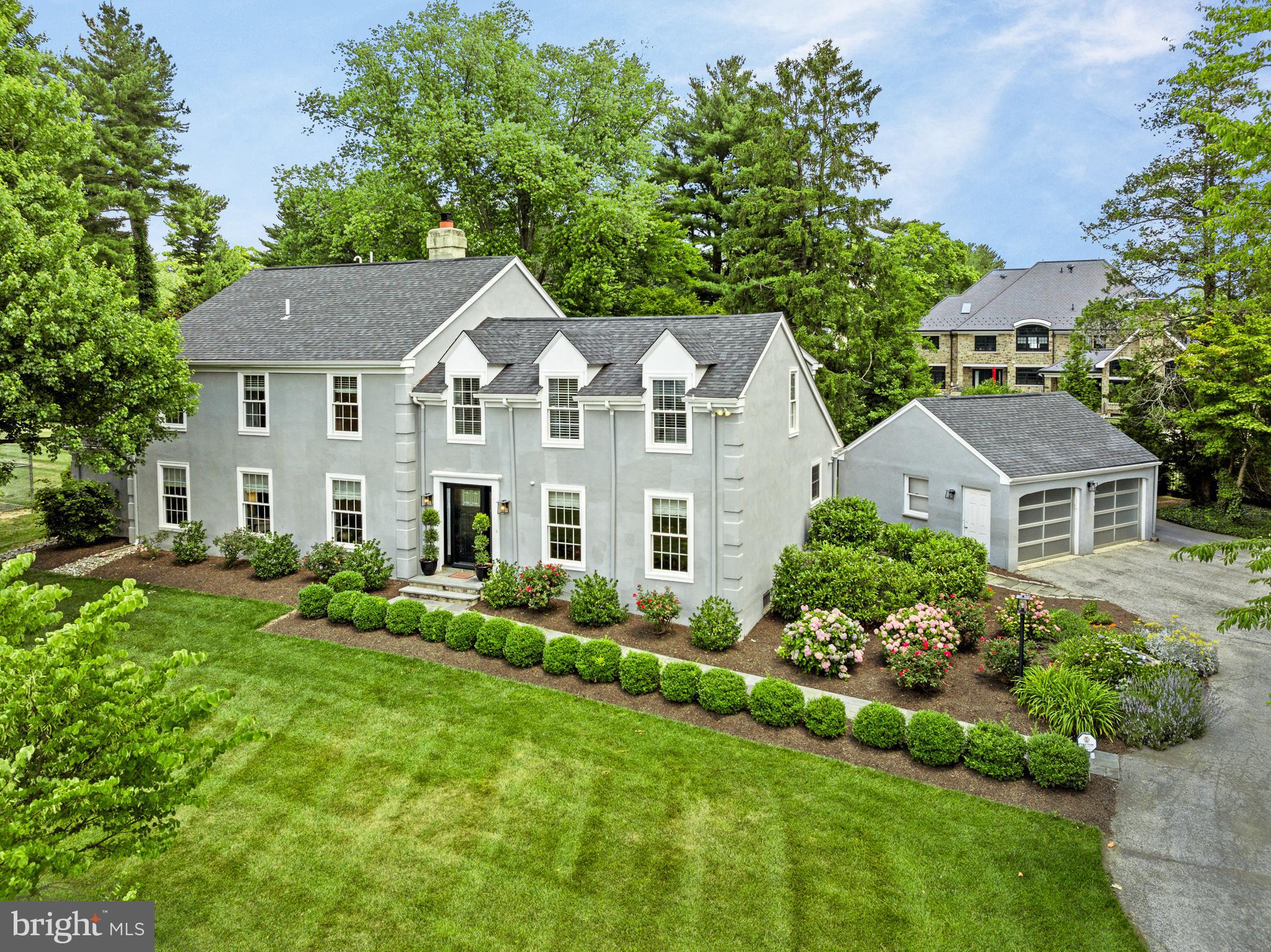 WHAT IF YOUR GETAWAY PLACE WAS HOME? (TM) - This 5000-square-foot newly renovated home is located in a cluster of three executive homes near Merion Golf Club. Its coveted location offers unmatched access to the Ardmore Train Station for the R5 to Philadelphia, rail service to NYC, major roadways, independent schools, universities, medical and corporate centers, and shopping and entertainment facilities.
A state-of-the-art indoor pool, tennis/sports court, and flat play lawn create the perfect setting for sports enthusiasts. There are two stone patios for dining and relaxation, surrounded by mature plantings, providing a tranquil and private setting.
An open kitchen and dining concept is perfect for formal and casual gatherings. The chef's kitchen boasts handsome custom cabinetry, stone countertops, the largest Thermador Professional range with eight burners, a griddle, and both steam and convection ovens, a full-sized Subzero refrigerator, and a freezer unit, microwave drawer, multiple pantries, two sinks, an oversized island with seating and storage.
Opposite the dining room in this center hall, you will find a stylish living room with a gas fireplace accented by a stone surround. Adjacent to the living room is a family room and attached game room.
On the upper floor, a main suite was created with both elegance and function in mind. There are closets throughout, a walk-in closet, and a luxurious en-suite main bathroom with heated floors, a double vanity, a private toileting area, and a wonderful shower. There is a hall bath for a bedroom with an attached sitting room or office. Two additional generously sized bedrooms are connected with a Jack-and-Jill bathroom.
The home has tremendous storage and built-ins in closets and the laundry room. The HVAC, roof, windows, and doors were all replaced during the renovation. The insulation was blown into the walls for maximum efficiency. New lighting and high hats are LED. The exterior is stucco and has been inspected. It is sealed with Elastomeric paint. The walkway is a stone with an outdoor lighting package and irrigation system.